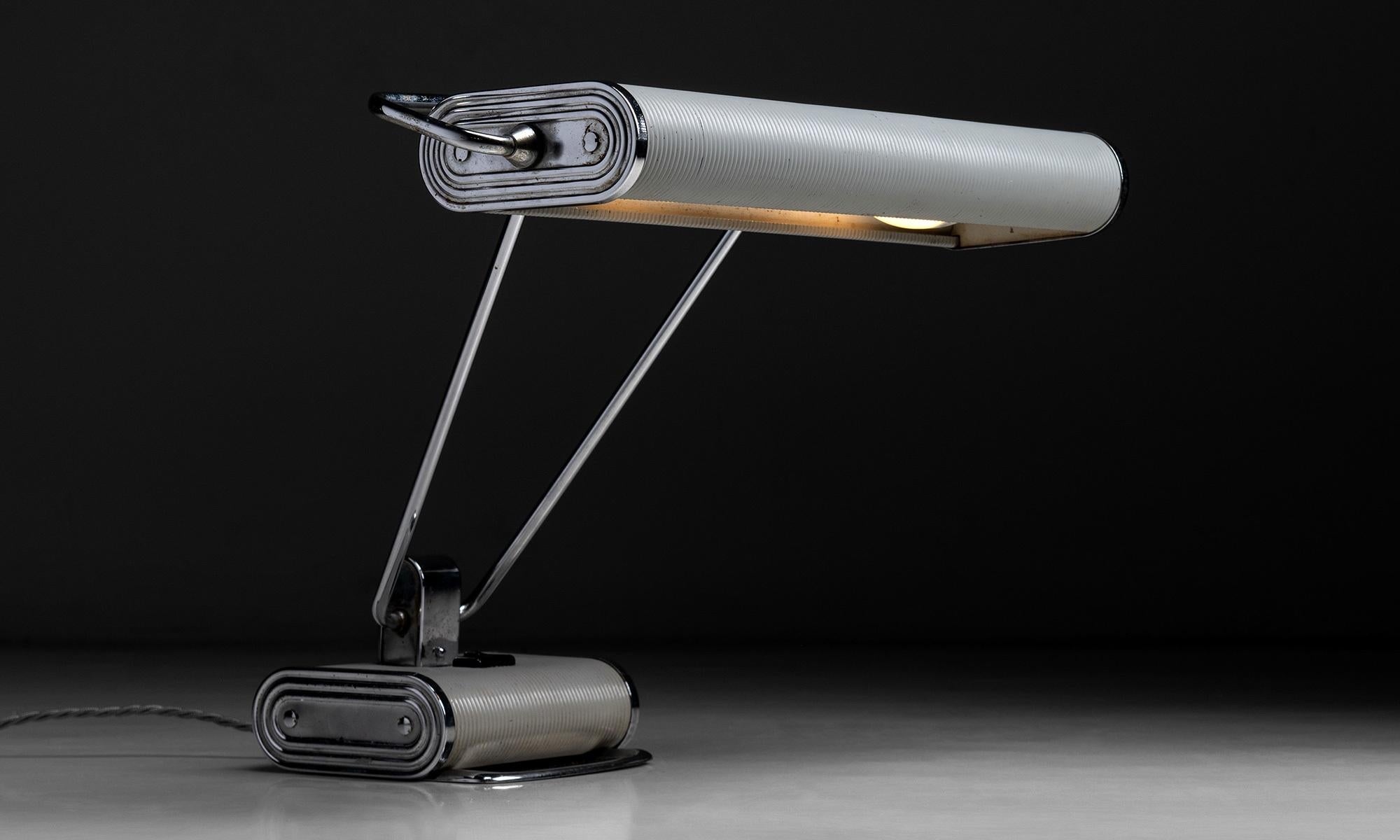 Chrome desk lamp by Eileen Gray

France Circa 1930

Modernist desk light designed by Eileen Gray for Jumo. In unusual off white and polished chrome color way.

Measures: 17.5” W x 11.75” D x 13” H.