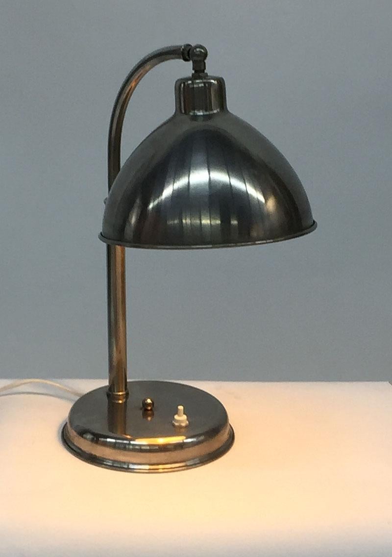 Chrome desk lamp with adjustable shade, 1930s

The desk lamp is rewired
The measurements are:

40 cm high, 24 cm wide and the depth is 20 cm (the shade)
The weight is 1737 gram.
