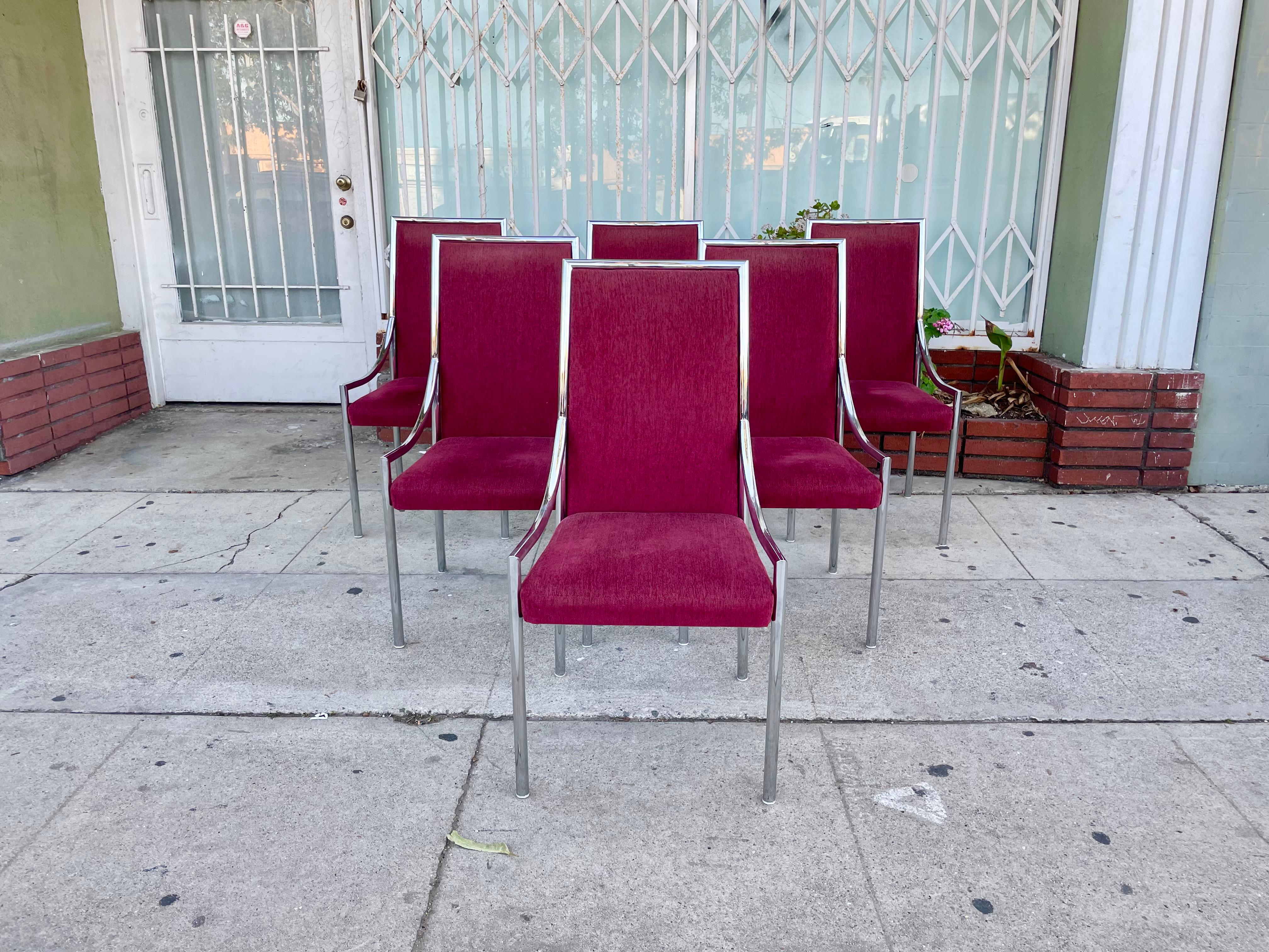 Beautiful set of six chrome dining chairs styled after Milo Baughman; these chairs feature a stunning red velvet upholstery with a chrome base and a beautiful slim high back. Making you want to throw out your old boring dining room chairs to make