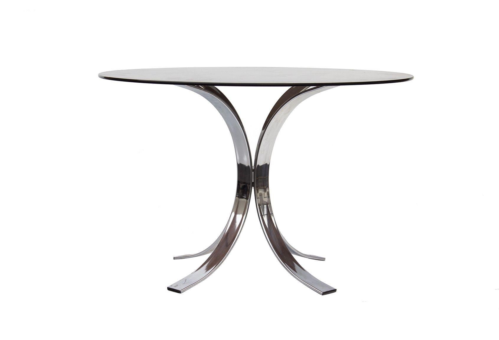 USA, 1970s
 
Chrome and glass dining table designed by Osvaldo Borsani for Stow & Davis. 
 
Condition notes: In very good vintage condition. Fine surface scratches to the smoked glass top. Fine marks to the base. Presents very well. 
