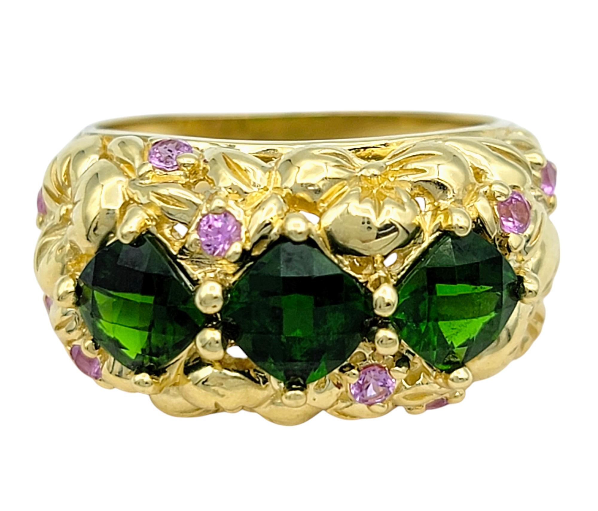 Ring Size: 7

Make a bold statement with this enchanting chrome diopside and pink tourmaline ring, a harmonious blend of vibrant colors and masterful artistry. Featuring three mesmerizing cushion checkered cut chrome diopside gemstones, their lush