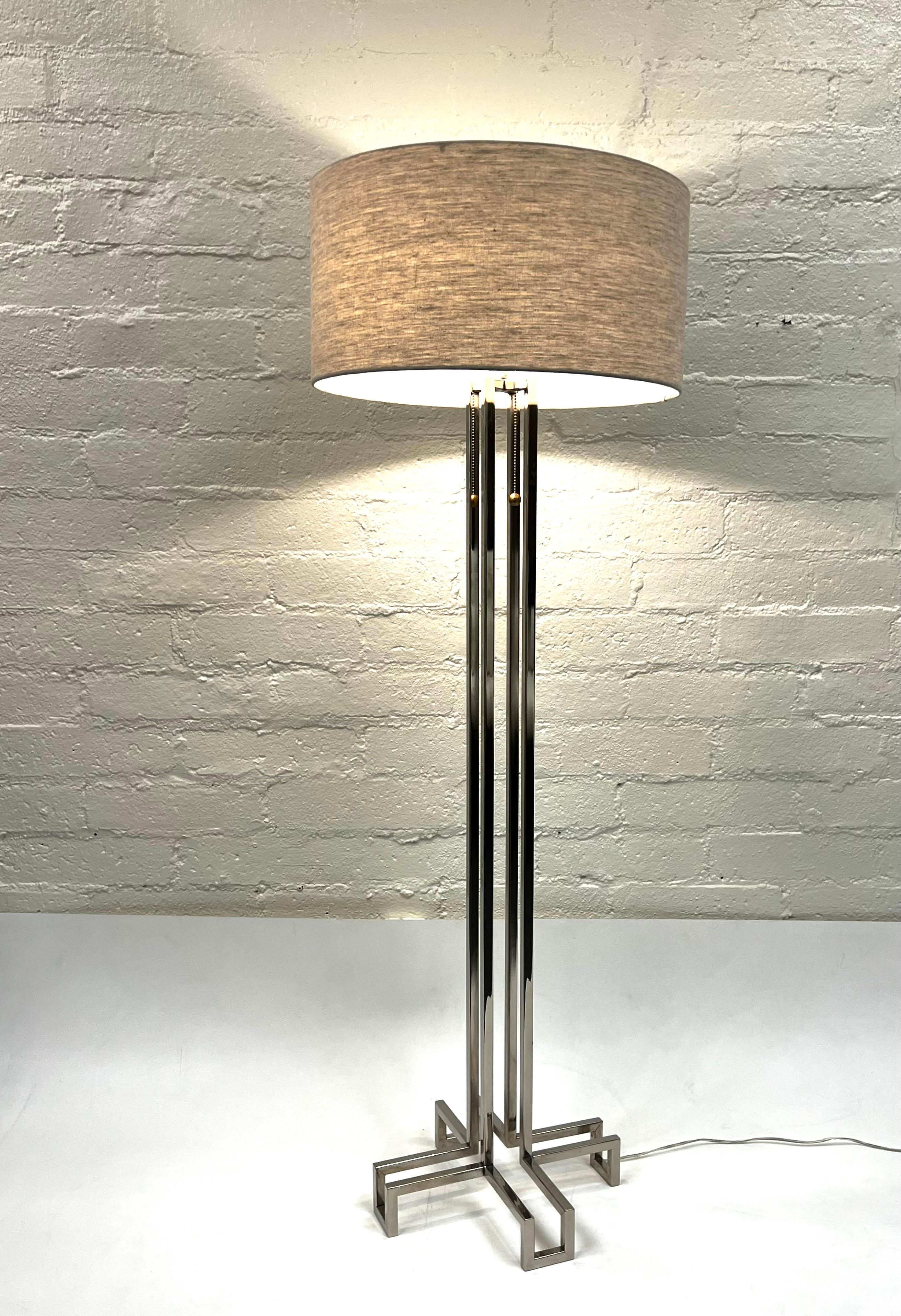 1970’s Polished chrome floor lamp by Charles Hollis Jones. 
Newly rewired and new oatmeal linen shade. 
It takes two 75w Max E26 Bulbs. 
Measurements: 20” Diameter, 58.5” High.
Base is 15” Wide, 15” Deep. 