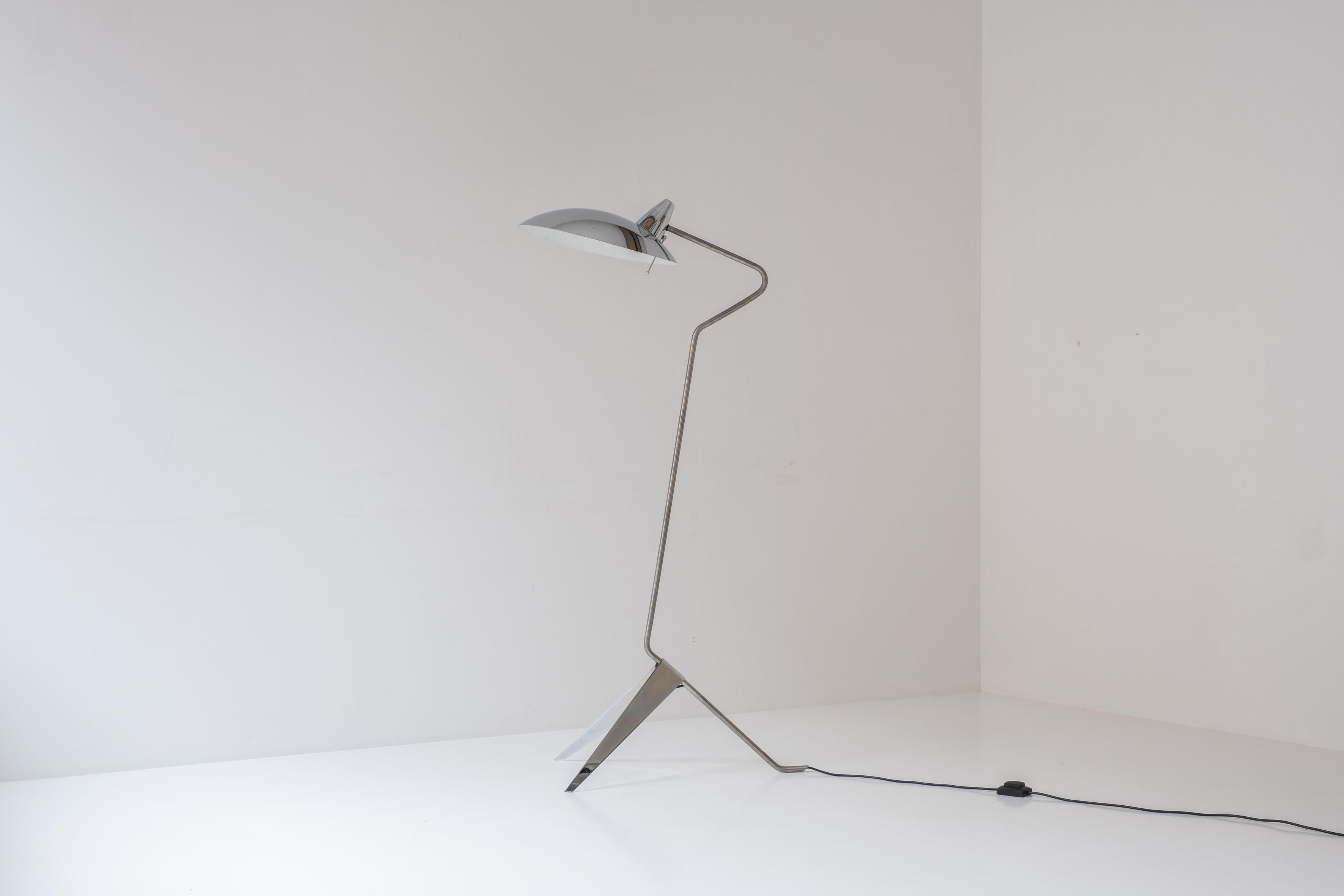 Lovely floor lamp from the 1970s. This floor lamp features a combination of nickel plated metal and a base and shade made out of chrome. Very elegant floor lamp in a marvelous condition.