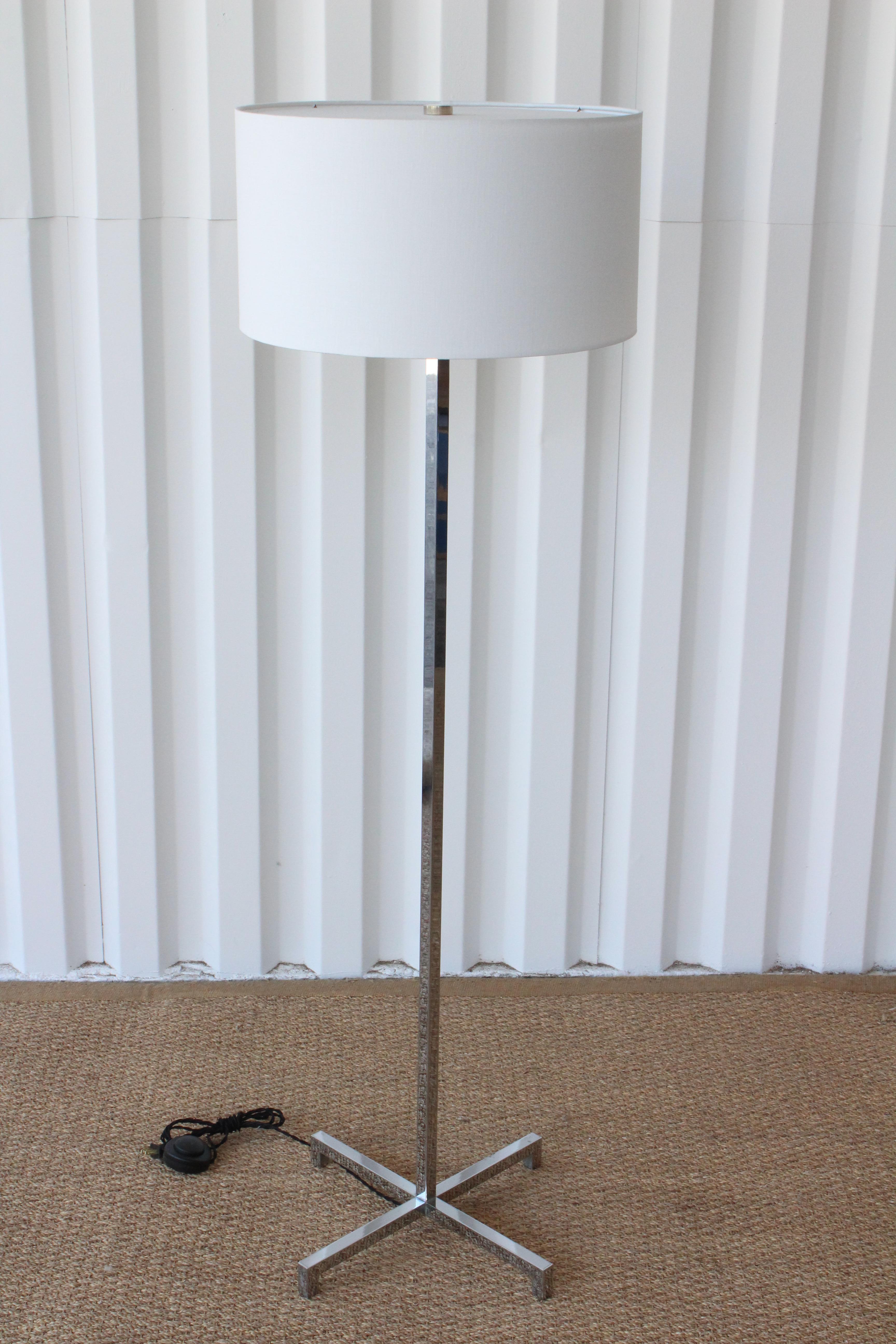 Chrome-plated solid steel floor lamp, designed by Robsjohn-Gibbings for Hansen. Newly rewired and fitted with a custom made linen shade. Chrome has been polished but there is some light oxidation in the corners of the base.. Base measures 13 x 13.