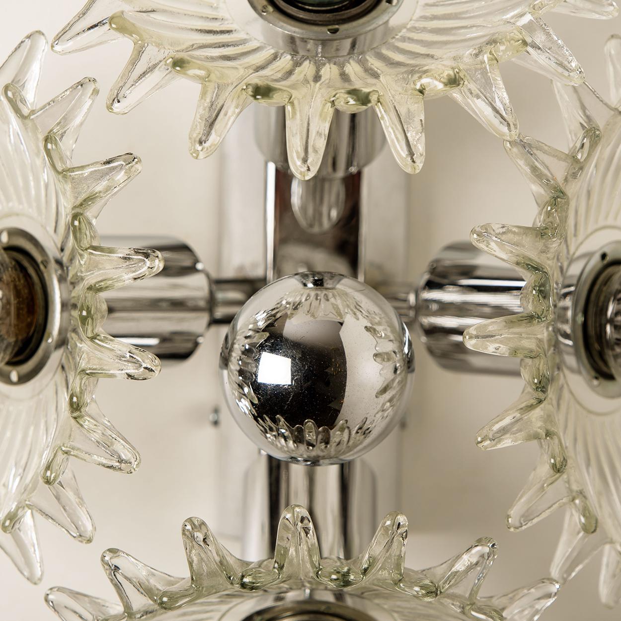 Exceptional wall lights from the late 60s, very rare inlaid with each four wonderful glass flowers with chrome frame, back plate and details. 
Manufactured by Brothers Cosack, Neheim.

In very good vintage condition. Each light requires 4 X E 14