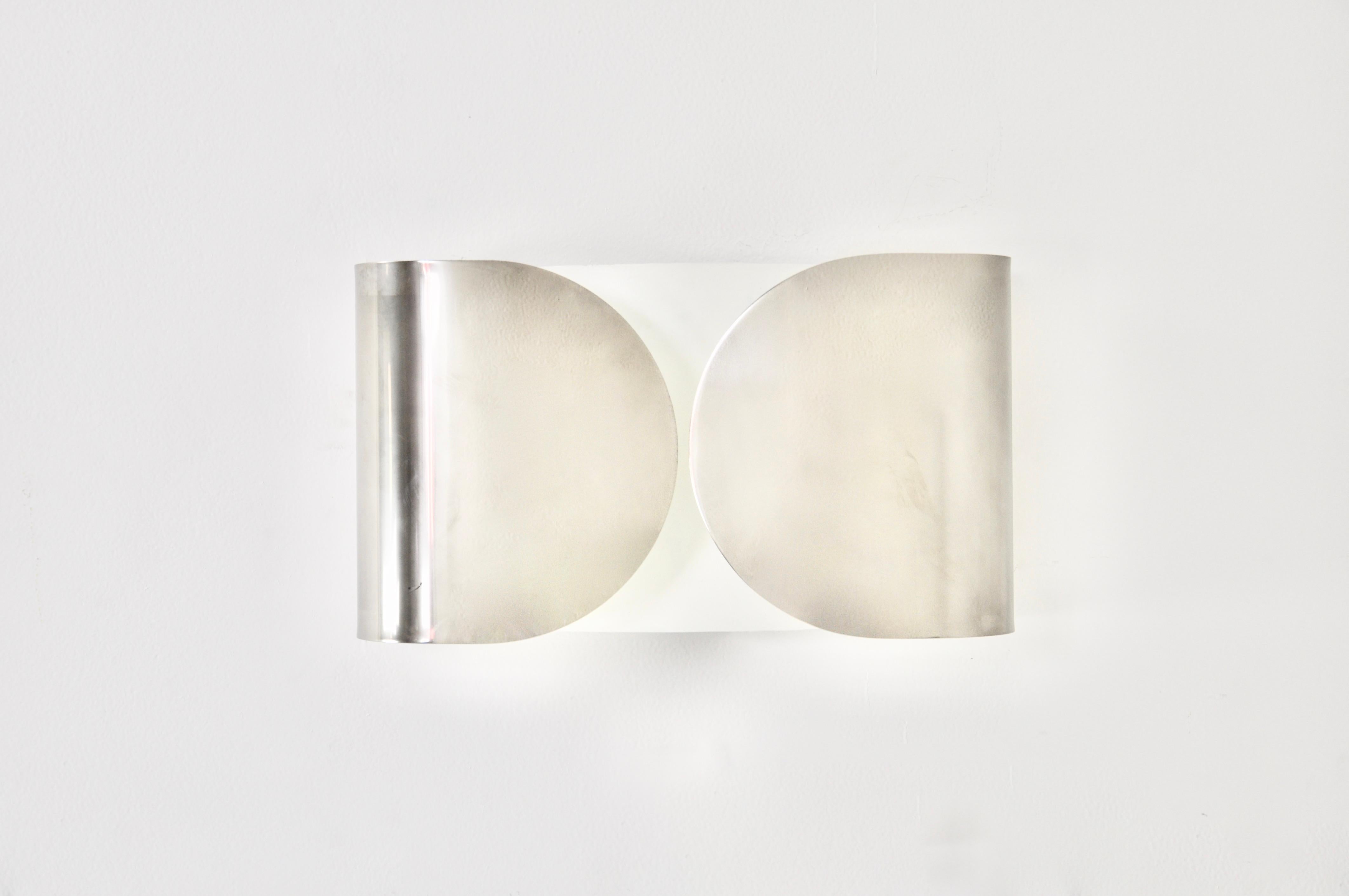 Sconce in chrome metal. stamped Flos. Wear due to time and age of the sconce.