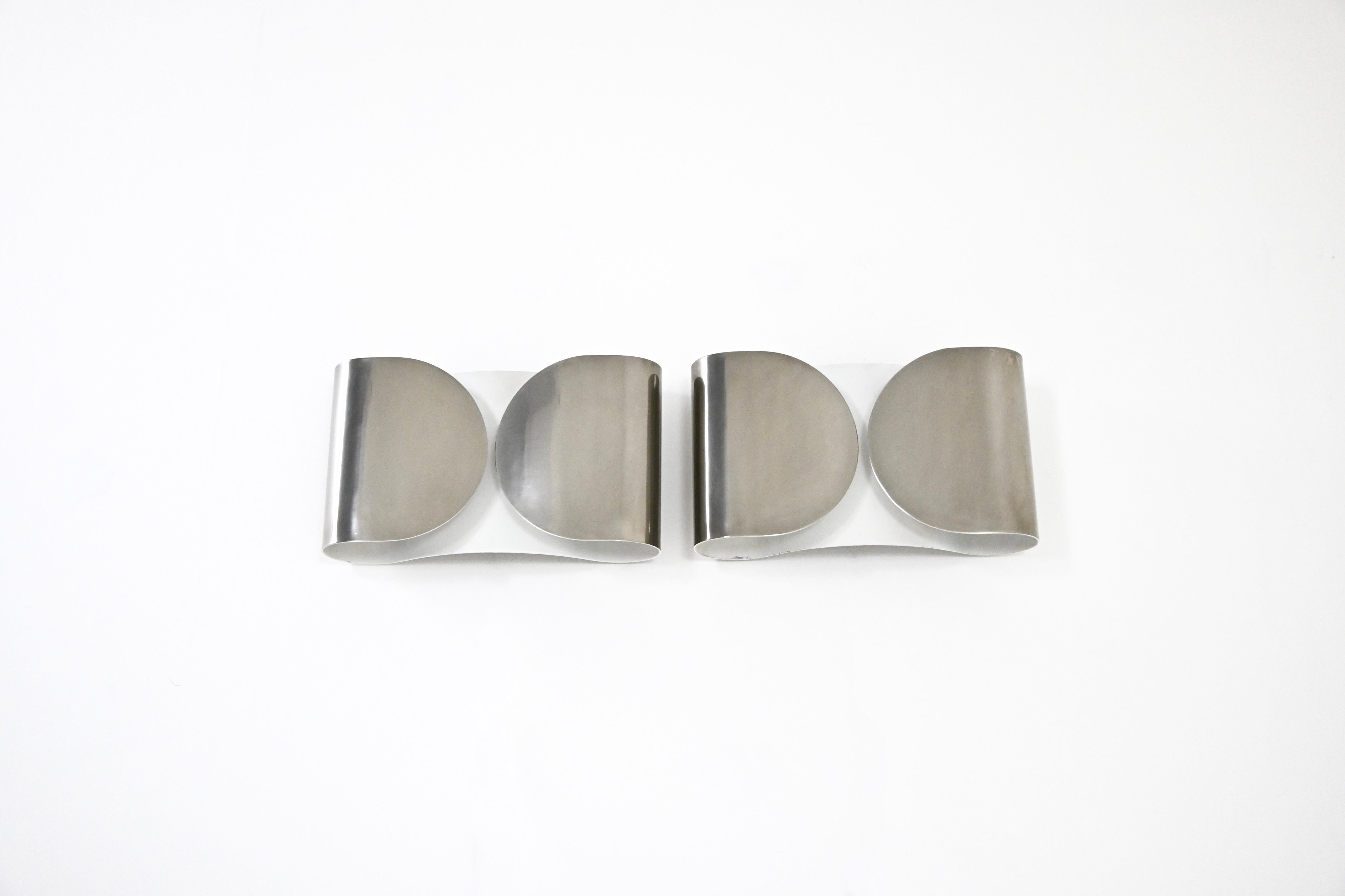 Pair of Sconces in chrome metal designed by Afra & Tobia Scarpa. Model: Foglio. Wear due to time and age of the sconces.
FOR SHIPPING, REQUEST US FOR RECEIVE THE BEST PRICE
