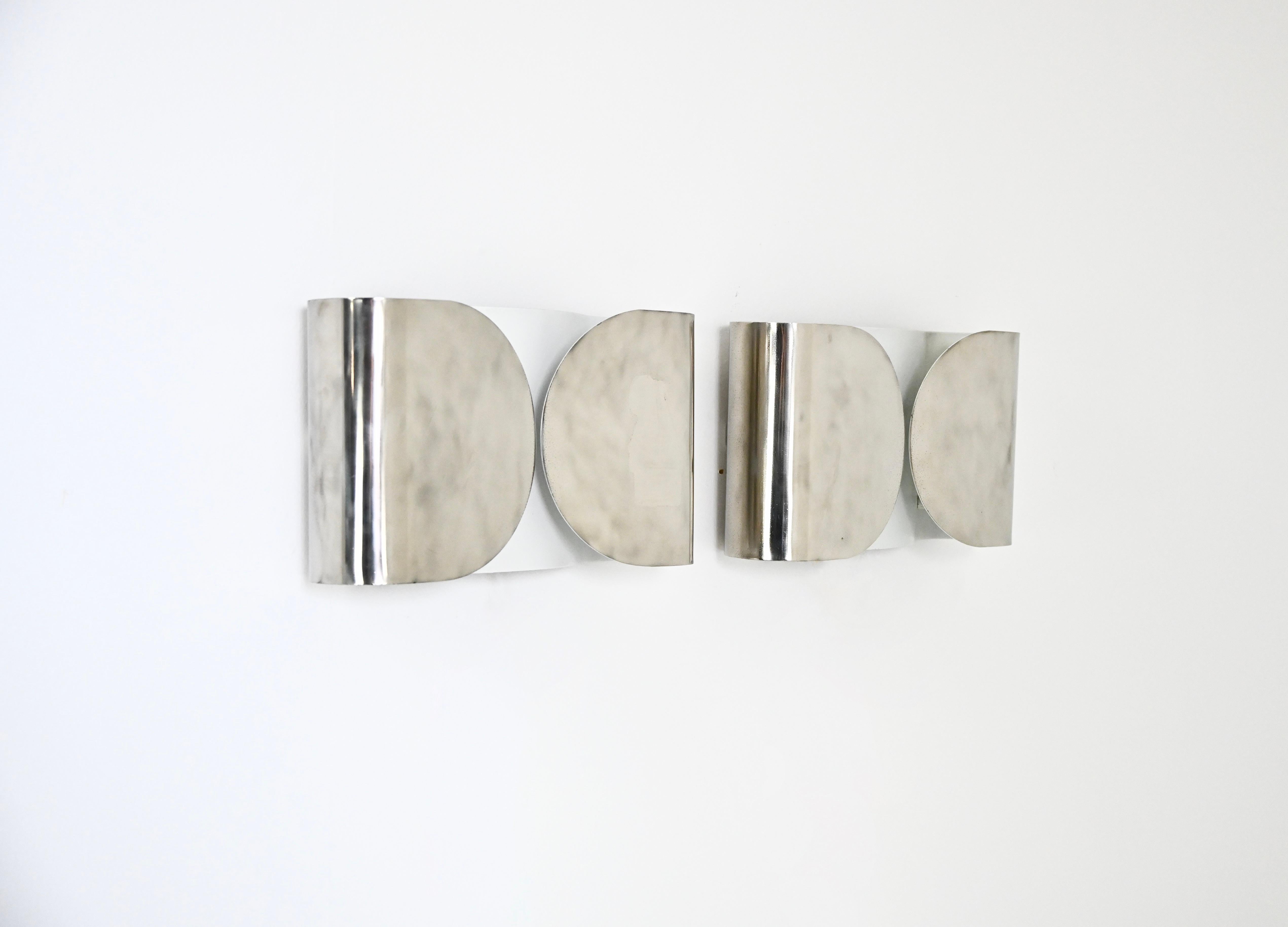 Pair of Sconces in chrome metal designed by Afra 
Tobia Scarpa. Model: Foglio. Wear due to time and age of the sconces.
FOR SHIPPING, REQUEST US FOR RECEIVE THE BEST PRICE
