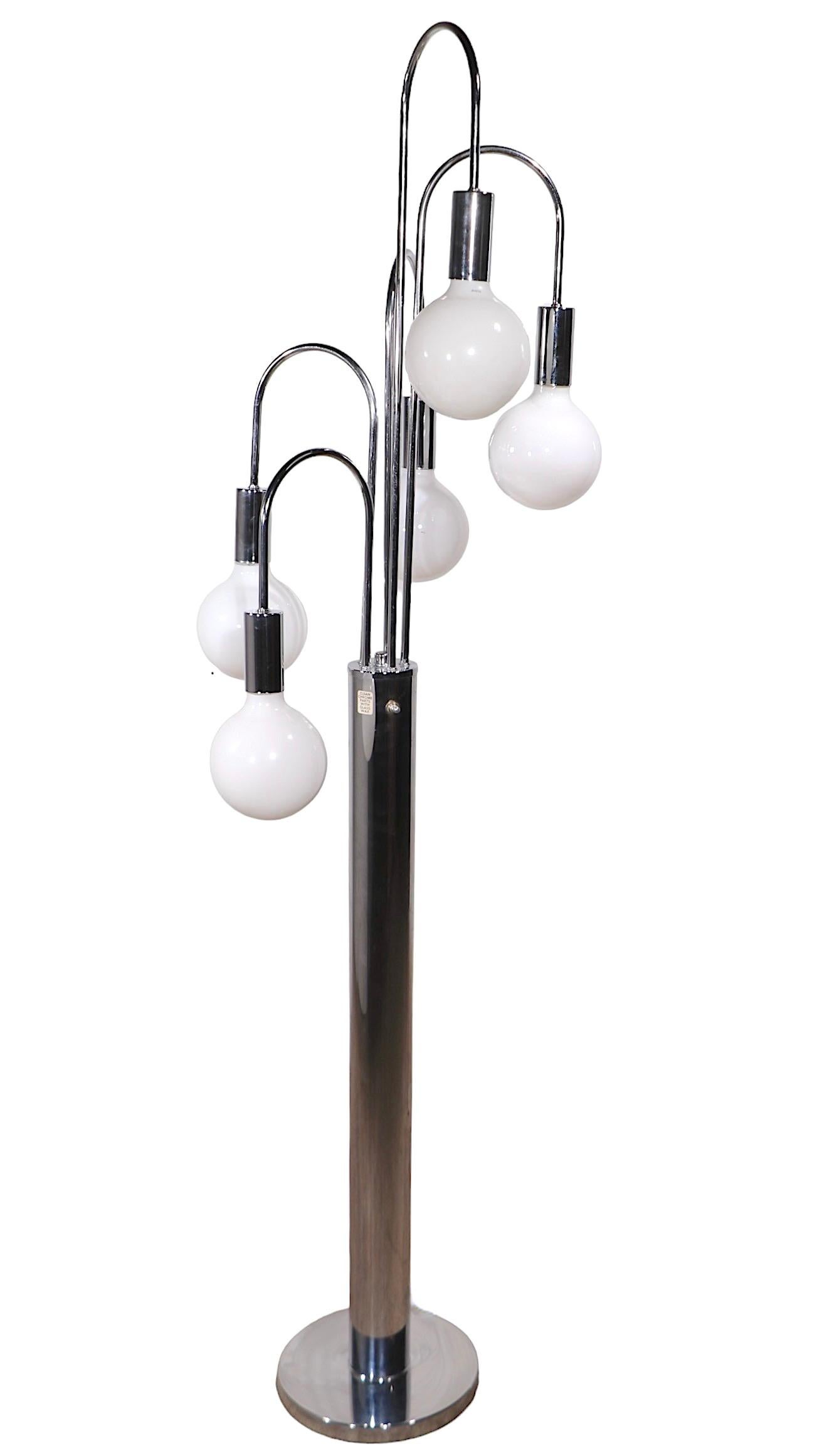 Hard to find Space Age, Hollywood Regency, Mid Century period, chrome fountain form floor lamp, designed by Robert Sonneman, for the Laurel Lamp Company, circa 1960/70's. The lamp features five down facing arched  chrome  arms which connect to the