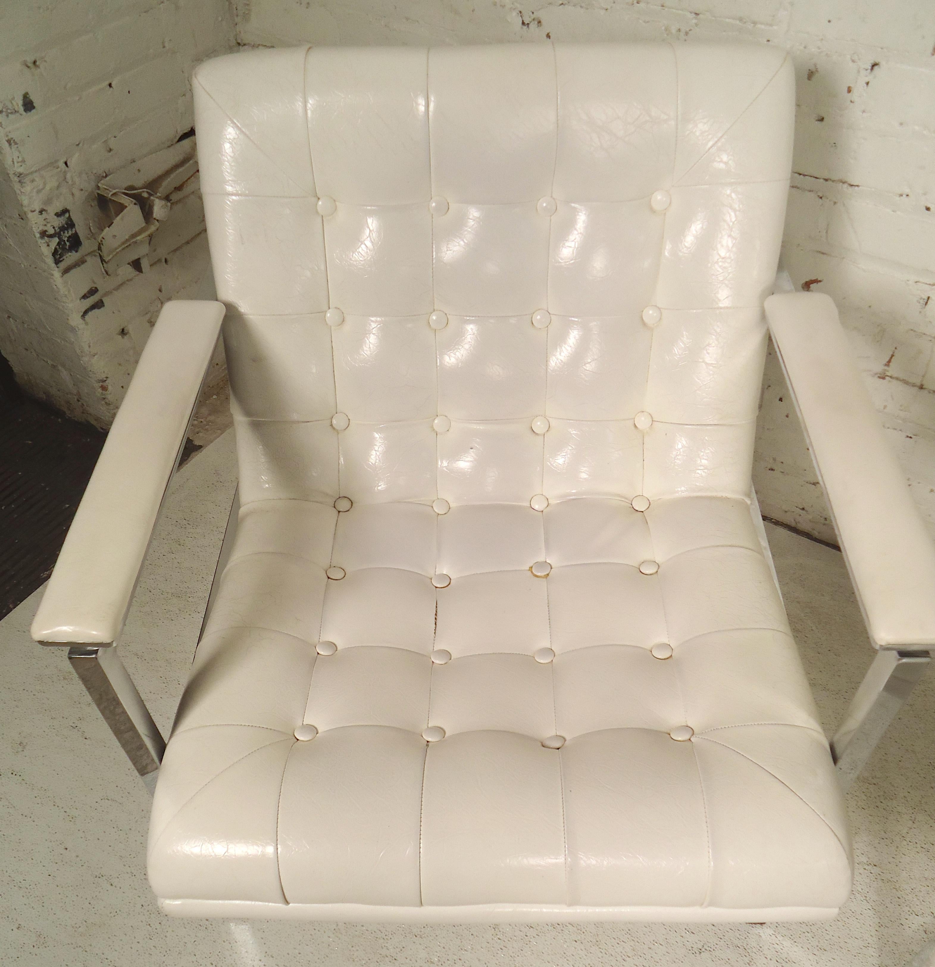 Modern style tufted armchairs with polished chrome frame. Chrome wraps around the back.

(Please confirm item location - NY or NJ - with dealer).
  