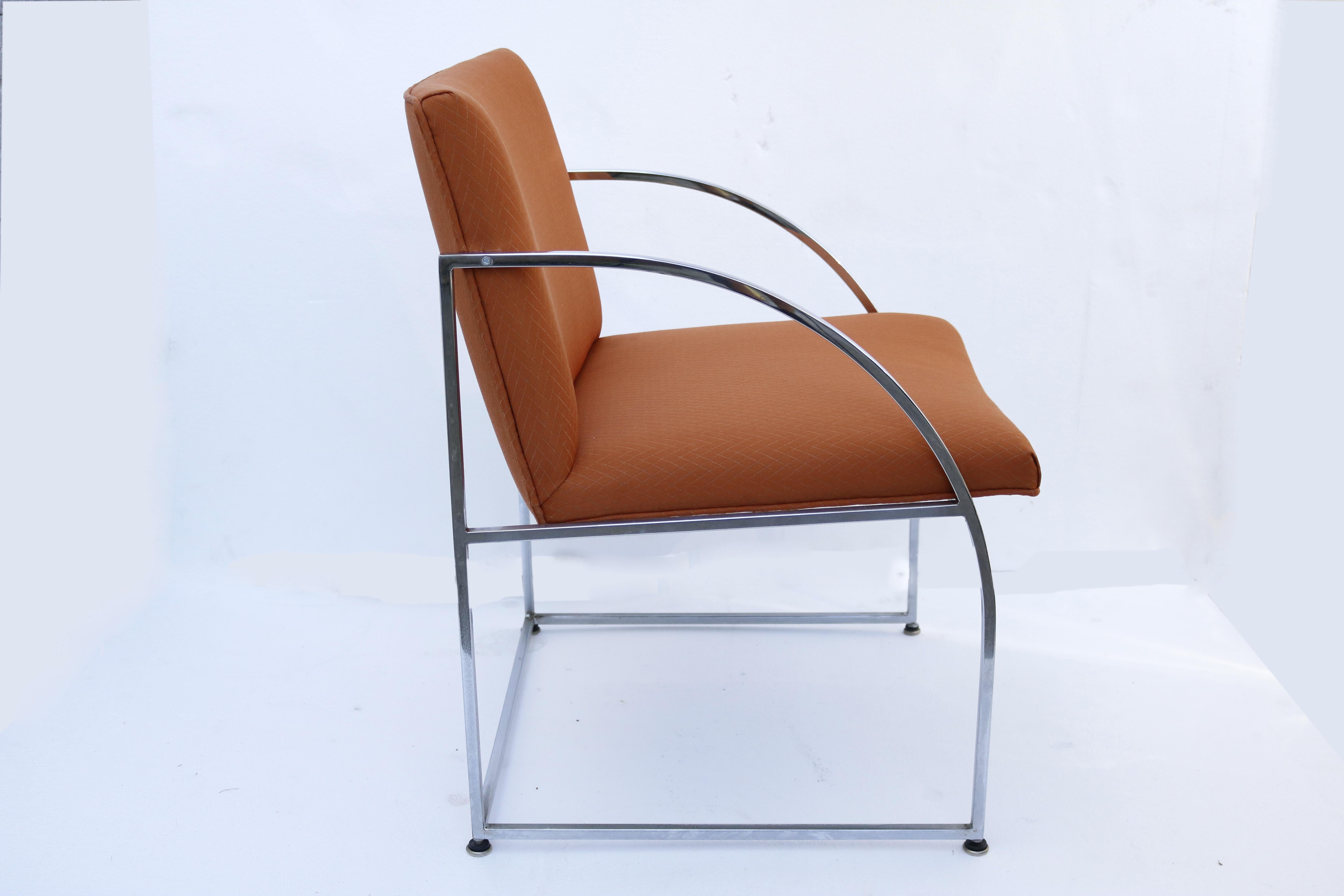 Architectural design chairs by Milo Baughman, framed in chrome and cushioned in summertime-rust/orange fabric.