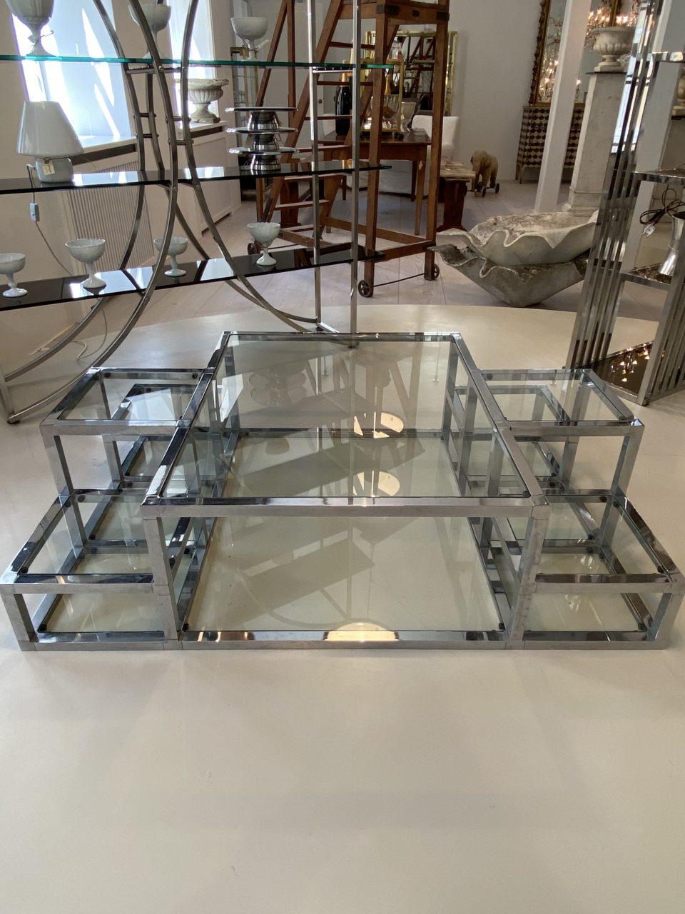 Handsome French quadrant formed coffee table, with different height glass shelves. Formed in the 1960s-1970s, with a definite nod reference to the metal and strong gorgeous designs of the Art Deco era in the 1930s.

Ideal and eye-catching as a