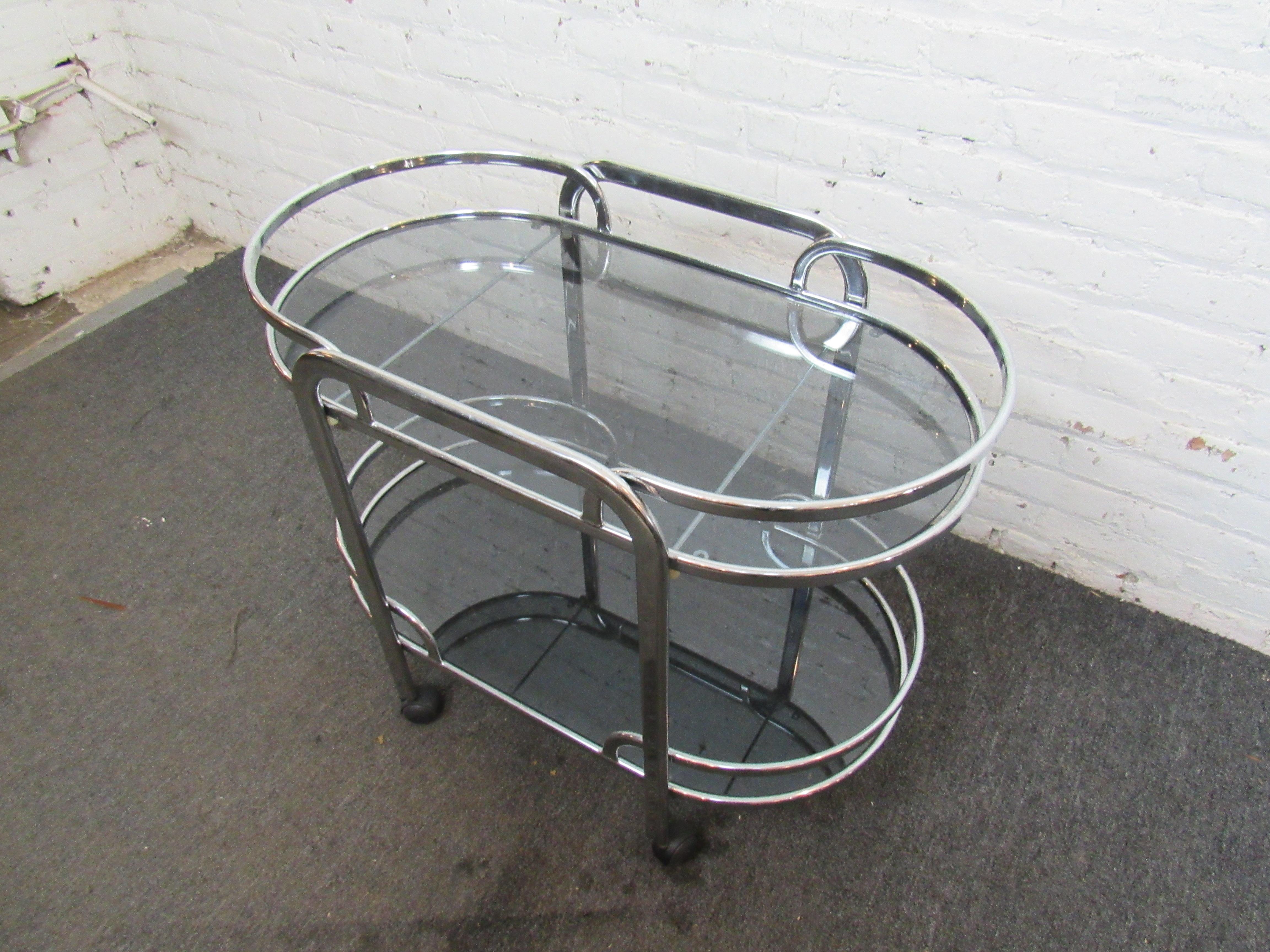 Great mid-century chrome bar with glass tops. On casters for easy mobility.
Location: Brooklyn NY.
 