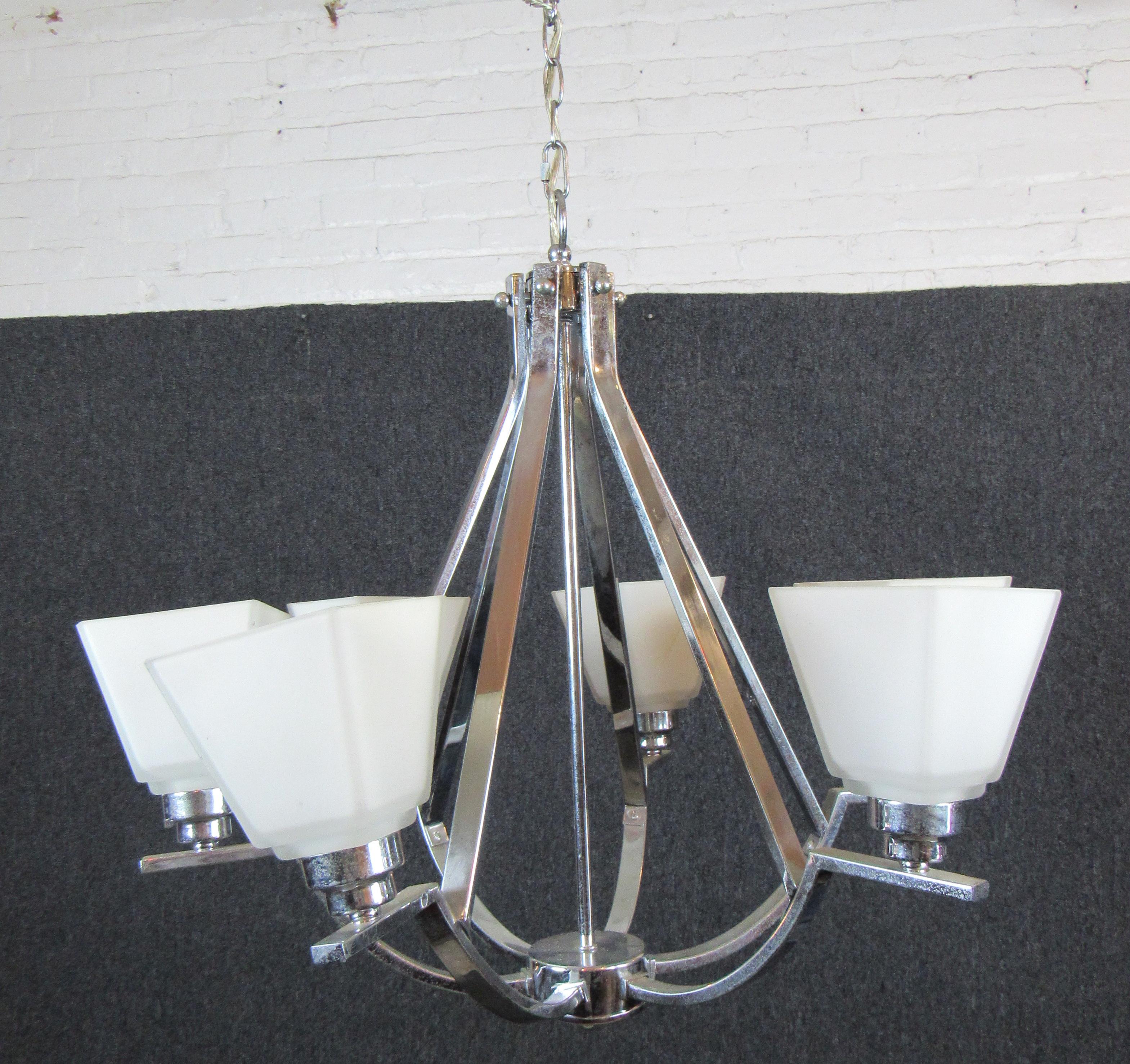 Six arm chandelier with polished chrome frame and frosted glass shades. Warm glowing light perfect for your dining room or entry way.
Please confirm location NY or NJ