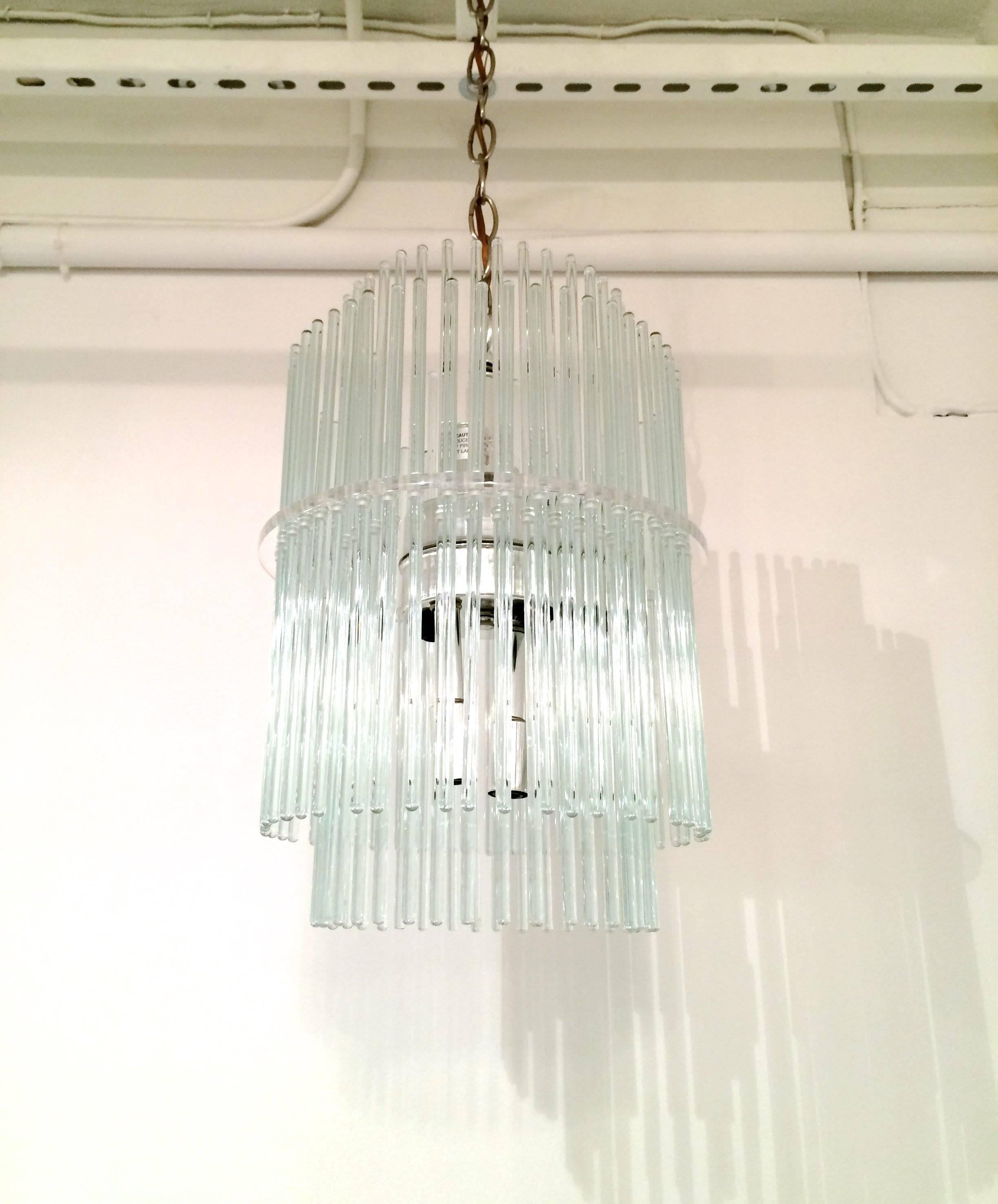 Two-tier glass rod chandelier by Gaetano Sciolari for Lightolier. Lucite center disk and Eight chrome sockets and fittings. Measurement length includes chain.