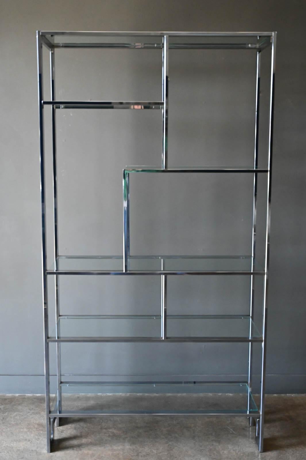 Chrome Greek Key Etagere by Design Institute of America, circa. 1970. Chromed steel and glass shelving make this piece very versatile as a shelving or display etagere or room divider. Excellent original condition with no rust or flaking. Glass