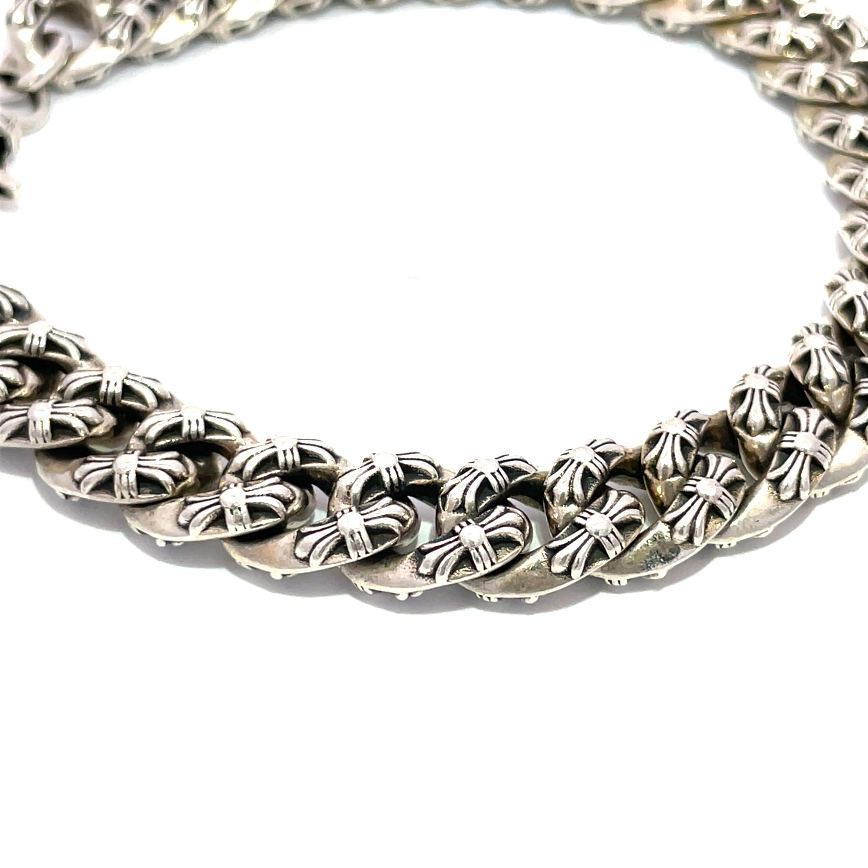 Elevate your accessory game with the exquisite Chrome Hearts Fancy Chain Bracelet, a stunning piece crafted from high-quality Sterling Silver 925. This 2006 vintage bracelet features a unique design that is mirrored on both sides, ensuring that it