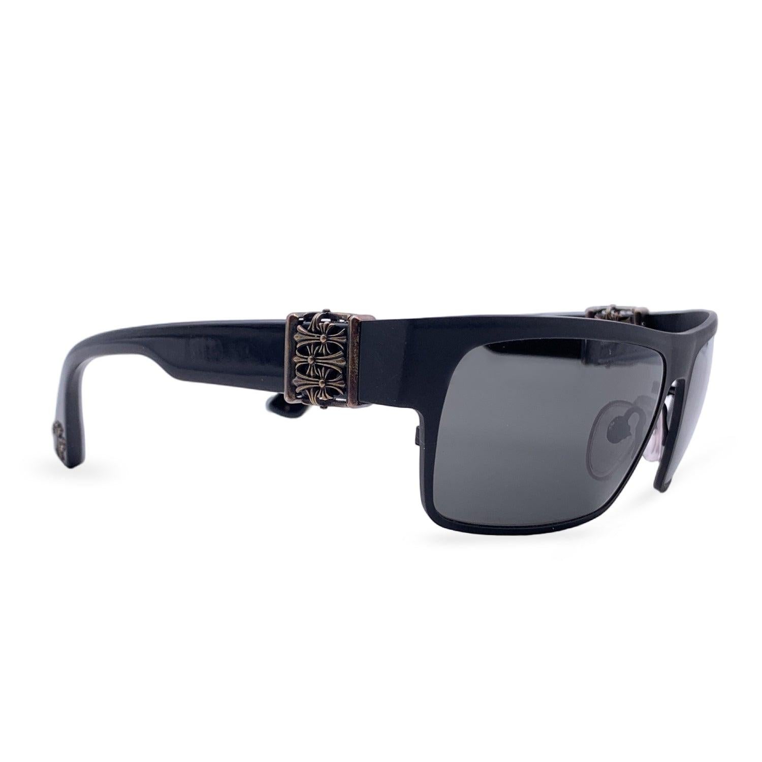 Chrome Hearts Sunglasses, Model Flavor Saver. Black metal front and acetate frame. Sterling silver detailing on temples and at the end of the ear stems. Original grey ZEISS lenses. Mods & refs: FLAVOR SAVER - MBK-BK - 61/16 - 136. Come with their