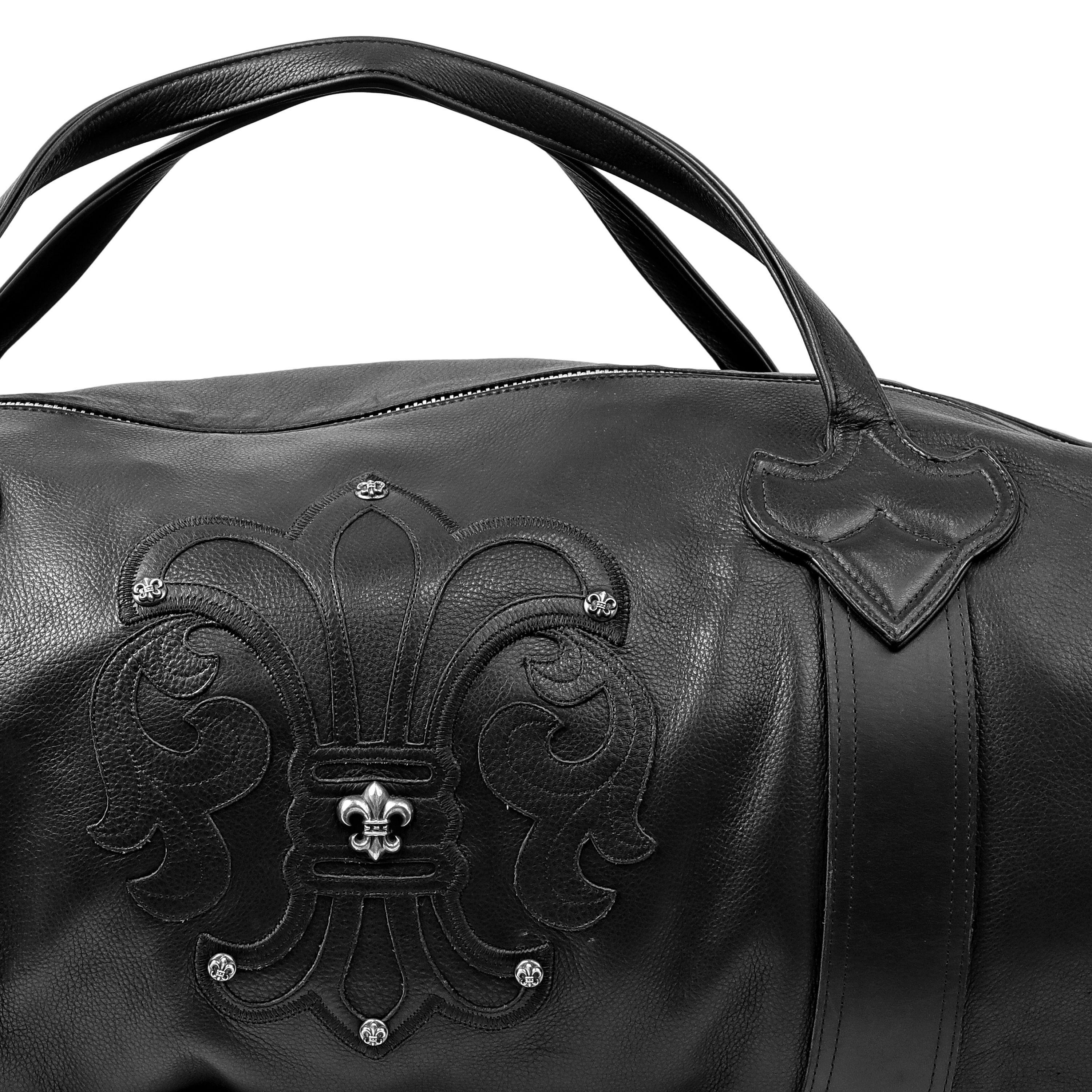 This authentic Chrome Hearts Black Limited Edition XL Travel Bag is in pristine condition.  Black glove leather duffle style travel bag.  Extra large capacity, silver hardware zippered top, double handles.

PBF 14052