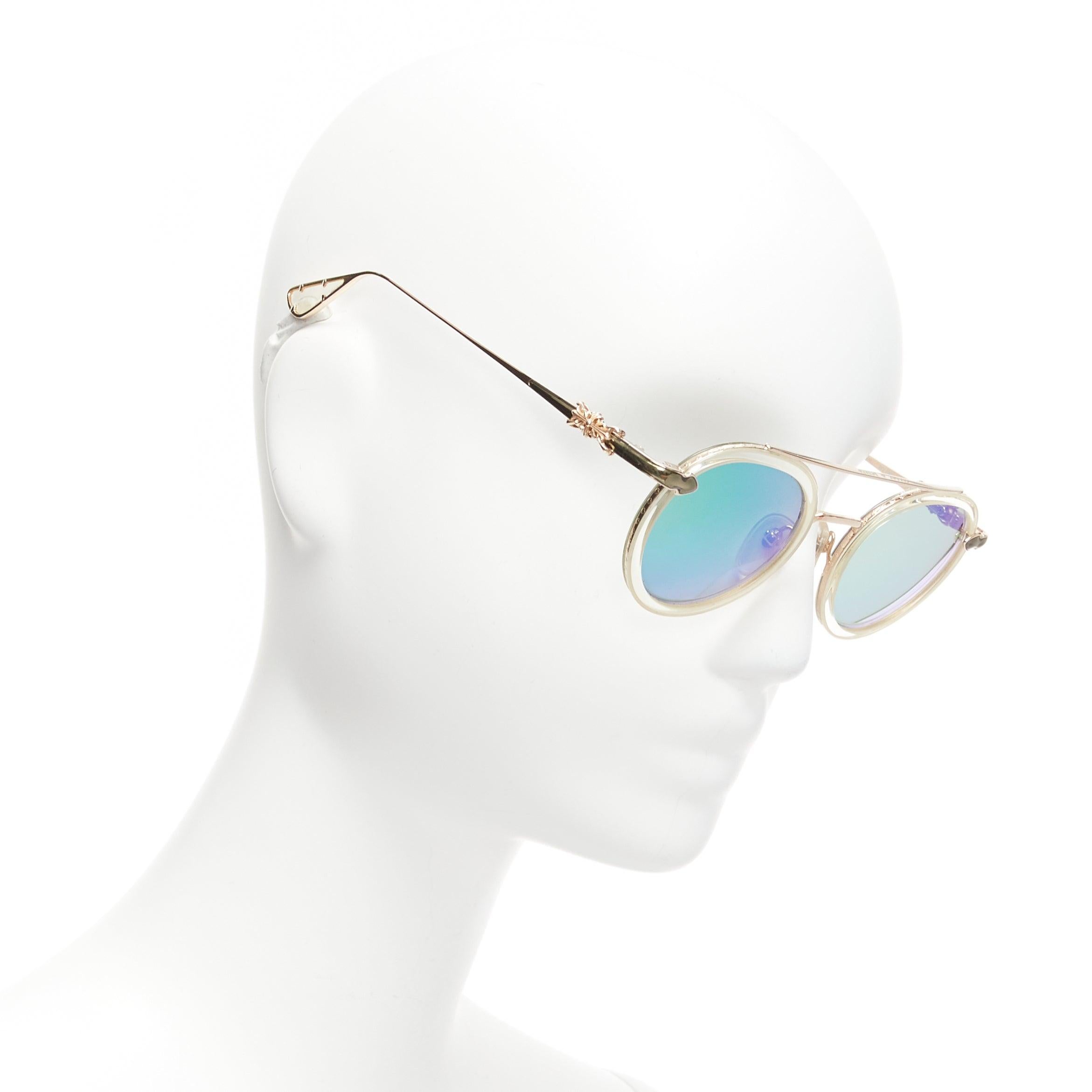 CHROME HEARTS Bo'jmir II reflective green lens clear frame sunglasses
Reference: NKLL/A00078
Brand: Chrome Hearts
Model: Bo'jmir II
Material: Plastic
Color: Green, Gold
Pattern: Solid
Made in: Japan

CONDITION:
Condition: Very good, this item was