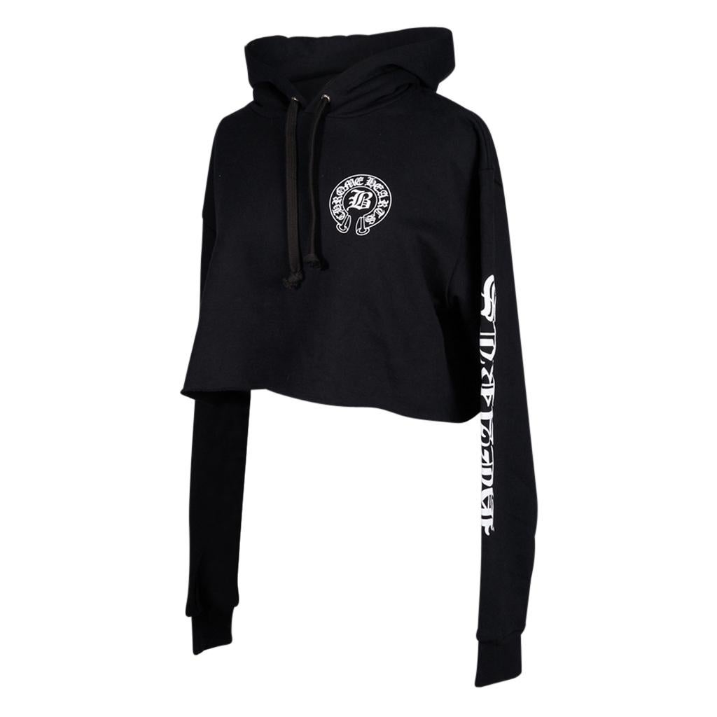 Guaranteed authentic Chrome Hearts black cropped hoodie.
Drawstring hoodie.
White Chrome Hearts horseshoe on chest and rear.
Long sleeve with white Chrome  / Hearts on each arm.
Large round Chrome Hearts logo at rear.
Fabric is cotton. 
final