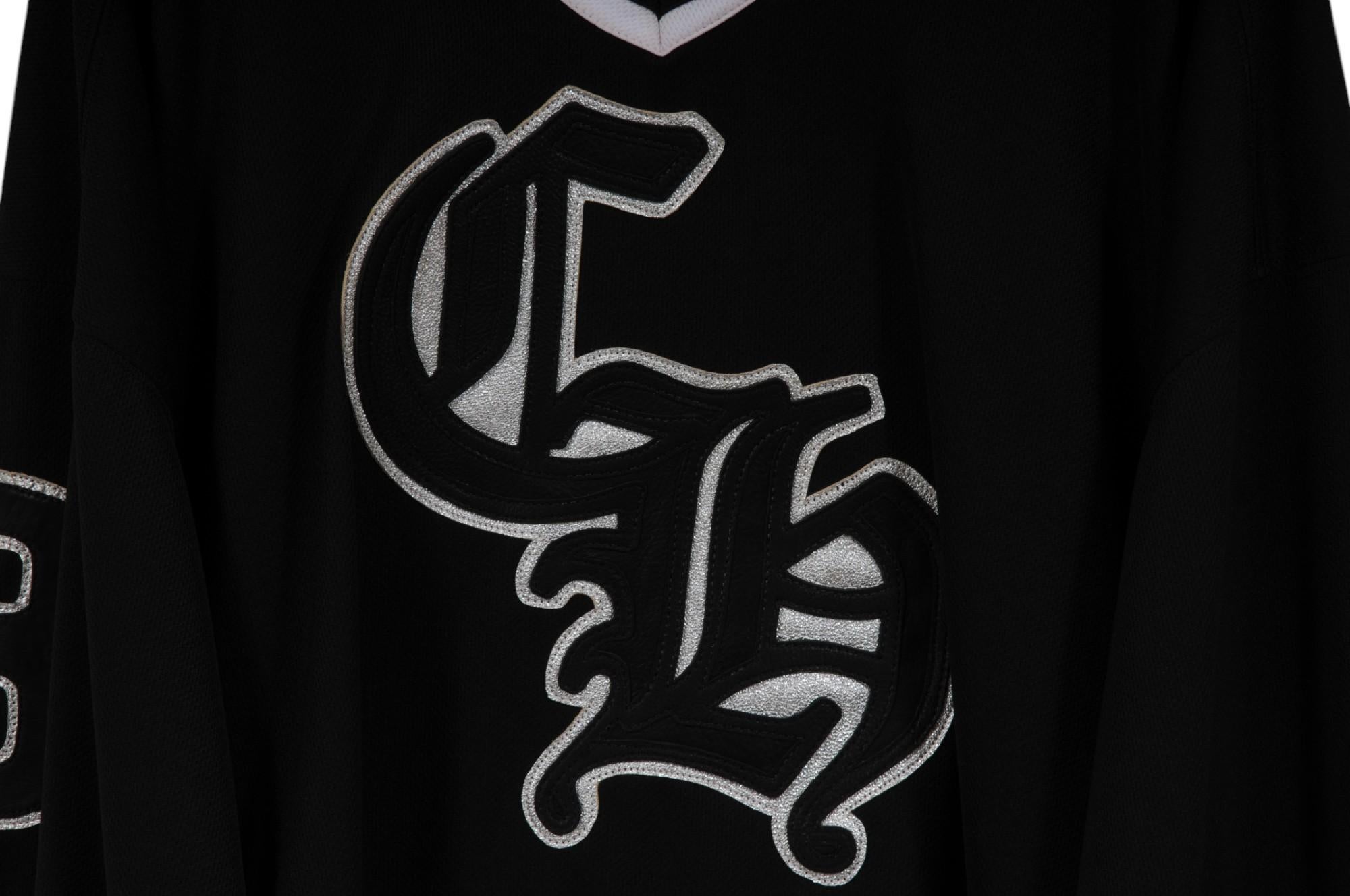 - Black exterior, gray and white stripe



- Tagged size XL



- Leather logo patch in the front and cross leather patch in the back 



- Silver cross in the back



Condition: 



The jersey is in overall great condition with no major