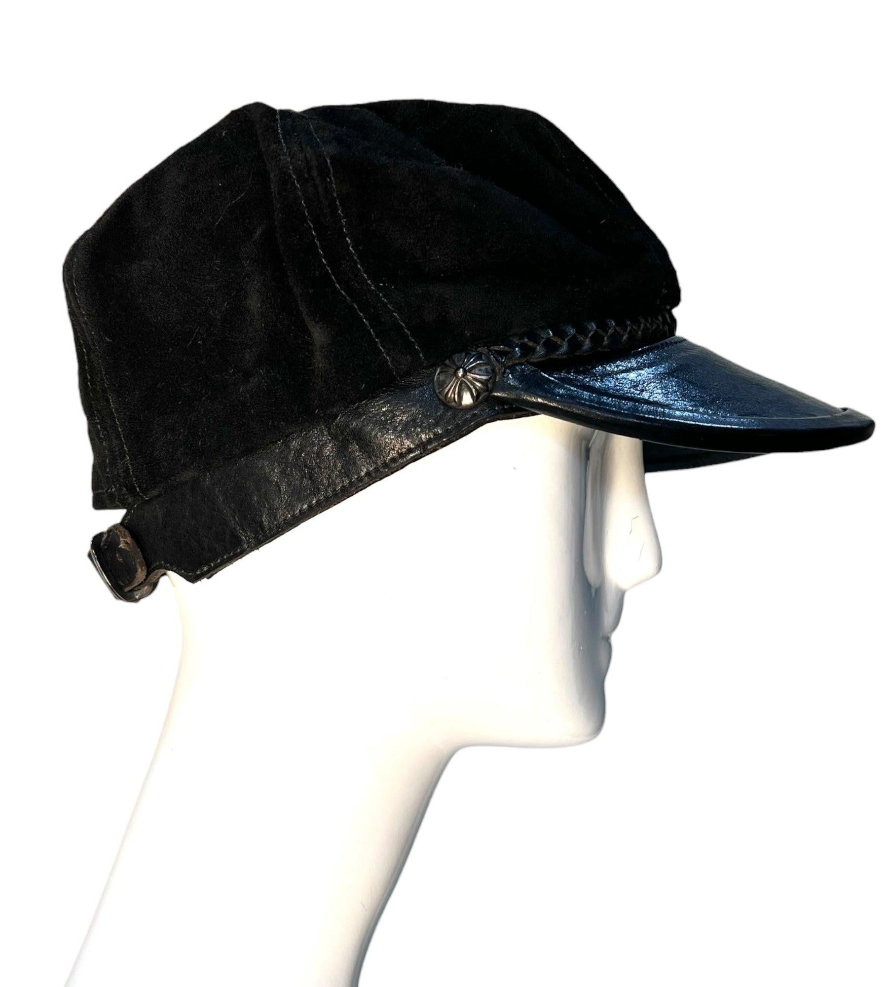 A rare Chrome Hearts leather and suede fisherman's cap circa 1994. Founded in 1988, the Los Angeles luxury brand came to be the eclectic brand we recognize today when Richard Stark and his wife Laurie Lynn Stark became the co-owners in 1994.

The