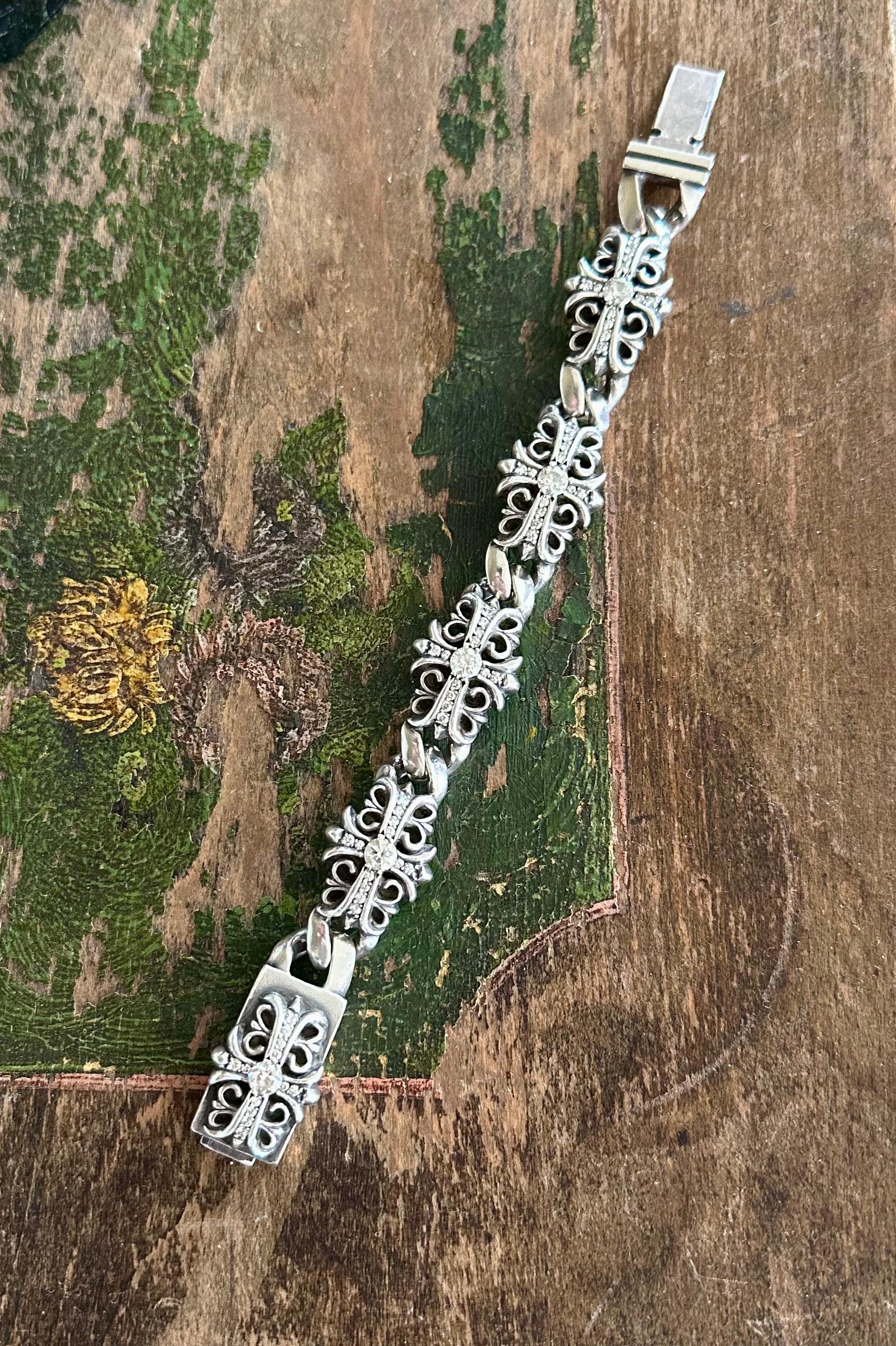 Chrome Hearts 1990s full diamond fleur-de-lis silver bracelet unisex 7.25 inches in length 1/2 inch with each section of the bracelet contains a half carat round diamond and numerous smaller diamonds parade set. Total Diamond weighed 5 cts
The