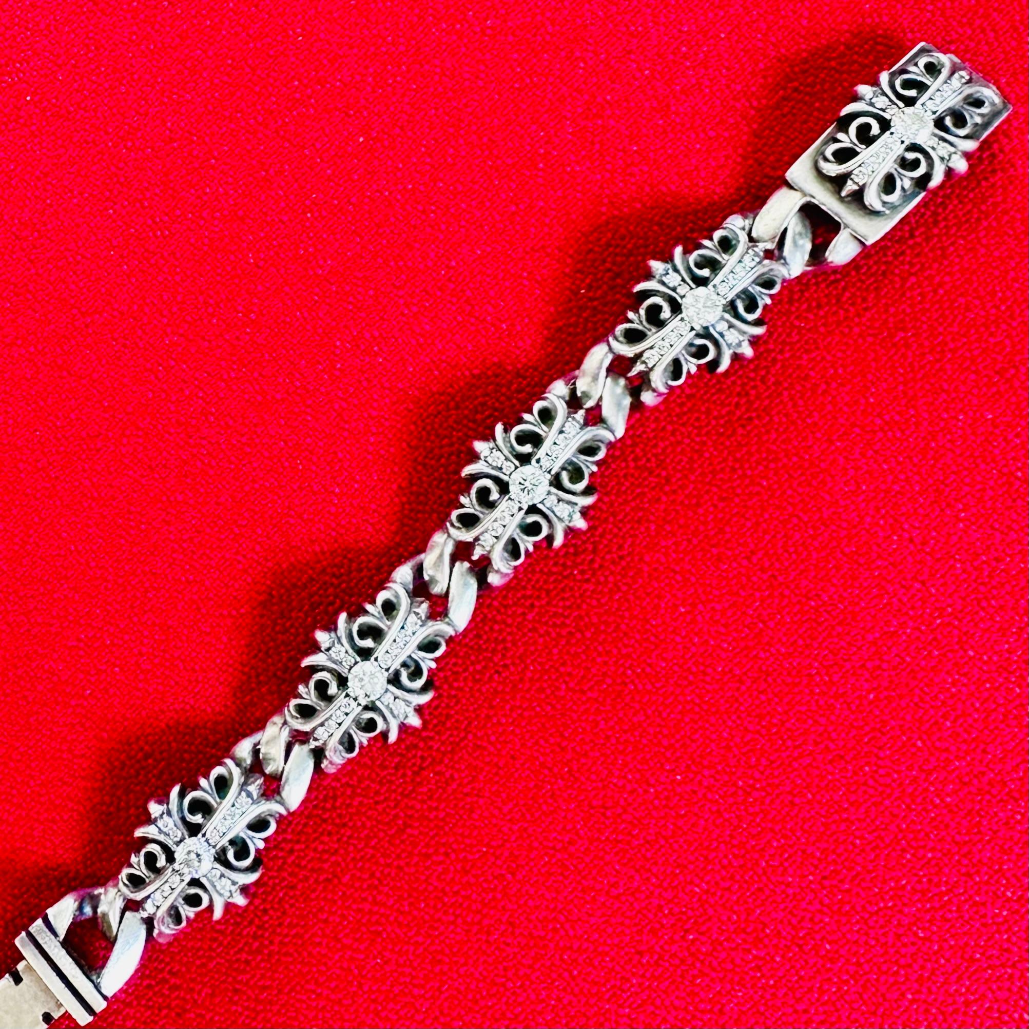 Chrome Hearts 1990s full diamond fleur-de-lis silver bracelet unisex 7.25 inches in length 1/2 inch with each section of the bracelet contains a half carat round diamond and numerous smaller diamonds parade set. Total Diamond weighed 5 cts
The