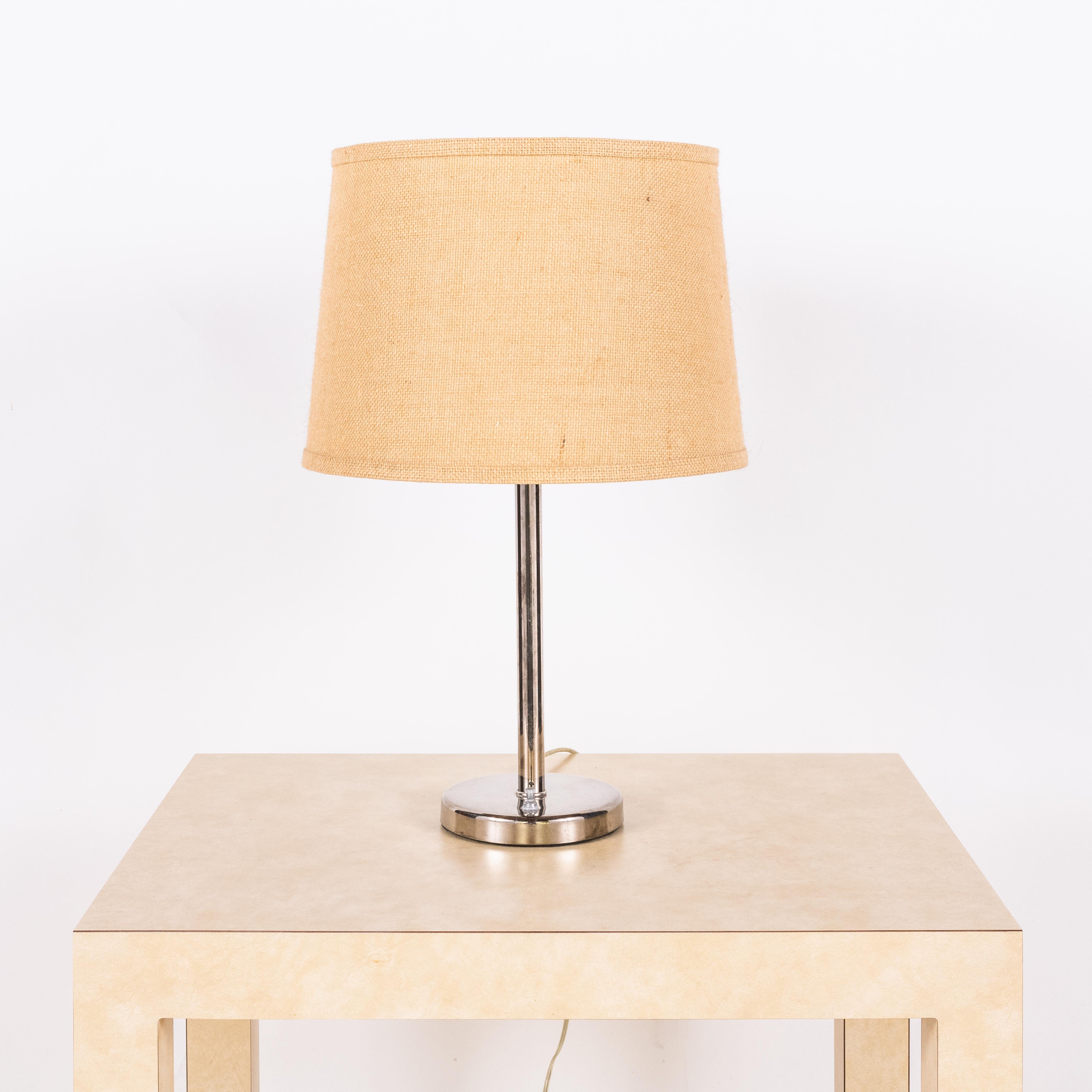 Chrome lamp with burlap shade by Nessen Lighting.

Dimensions listed (14 in. diameter x 22 in. tall) are the overall dimensions of the lamp with the shade.