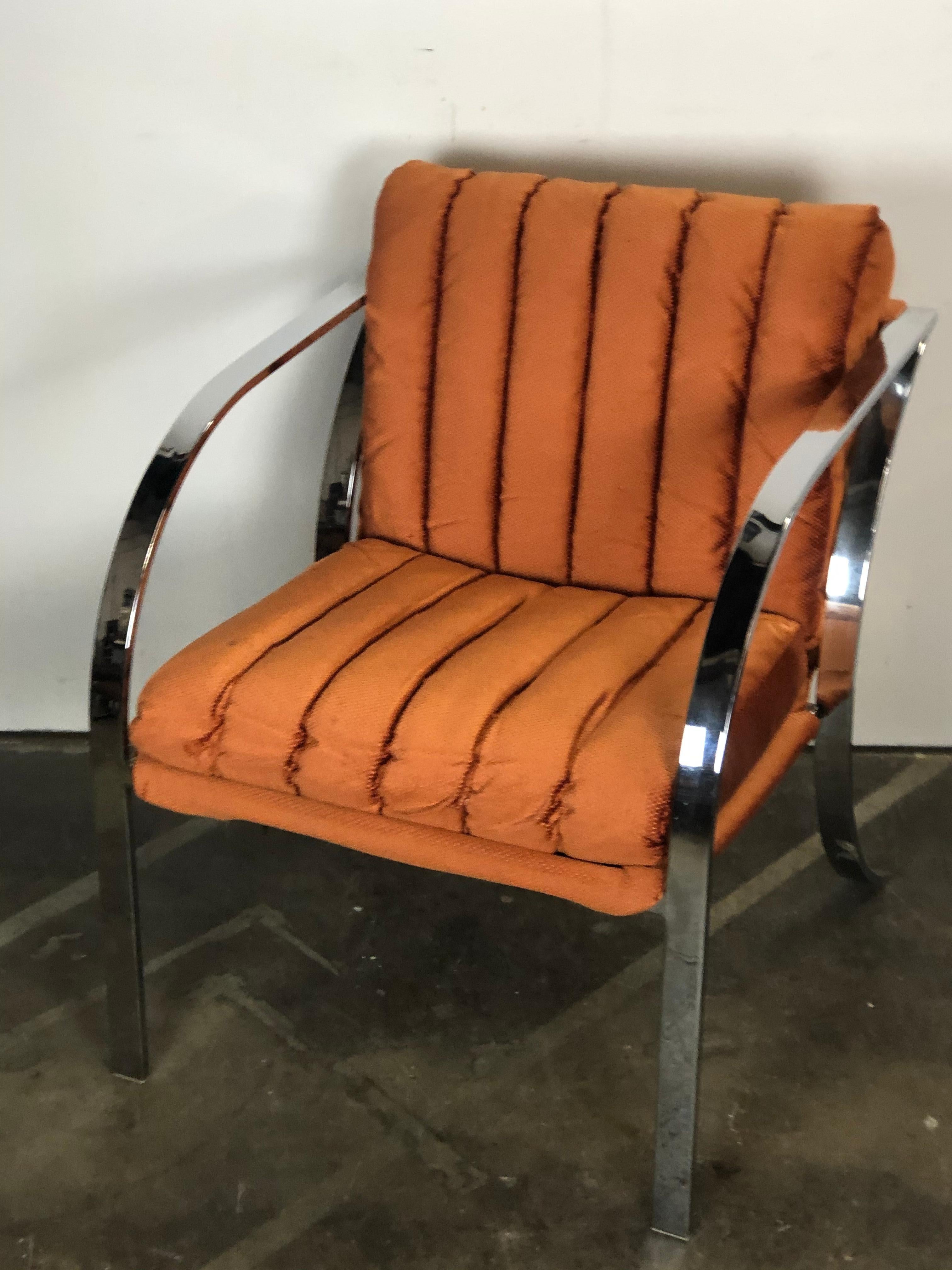 Swanky and cool Weiman/Warren Lloyd lounge chair with chrome frame and sexy lines. Original orange textile is extremely soft and shimmers. In good vintage condition. Very comfortable seat and back.