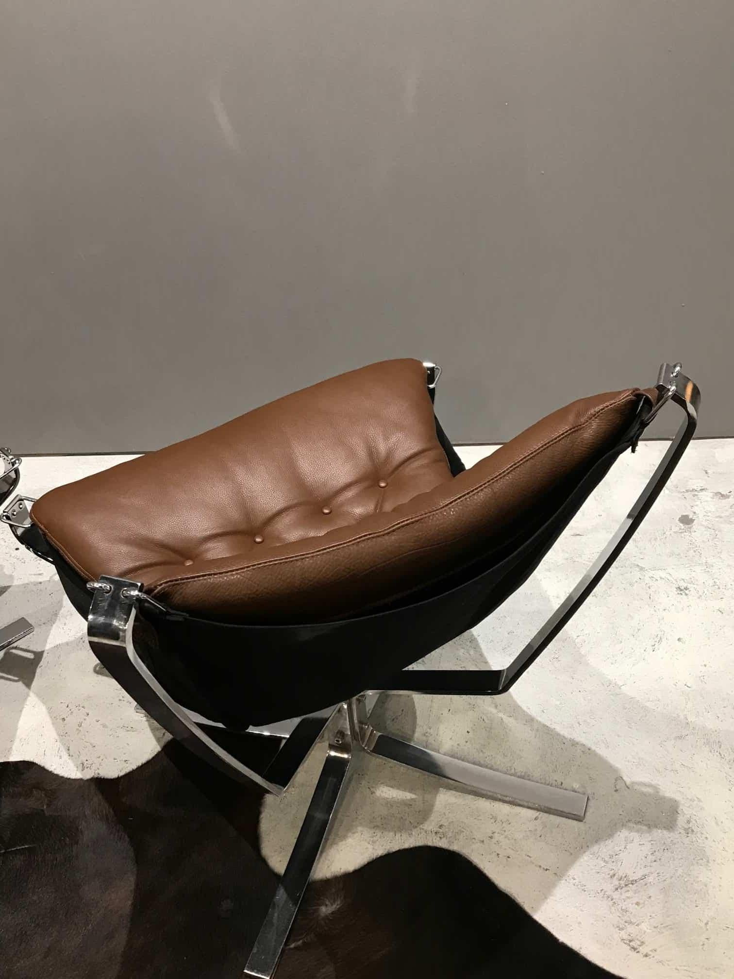 An original brown leather and chrome low back falcon chair and Footstool by Sigurd Ressell for Vatne Mobler. Norway, 1970s.
Leather has been reupholstered.
This set is in very good condition and are quickly becoming as iconic and recognised as the
