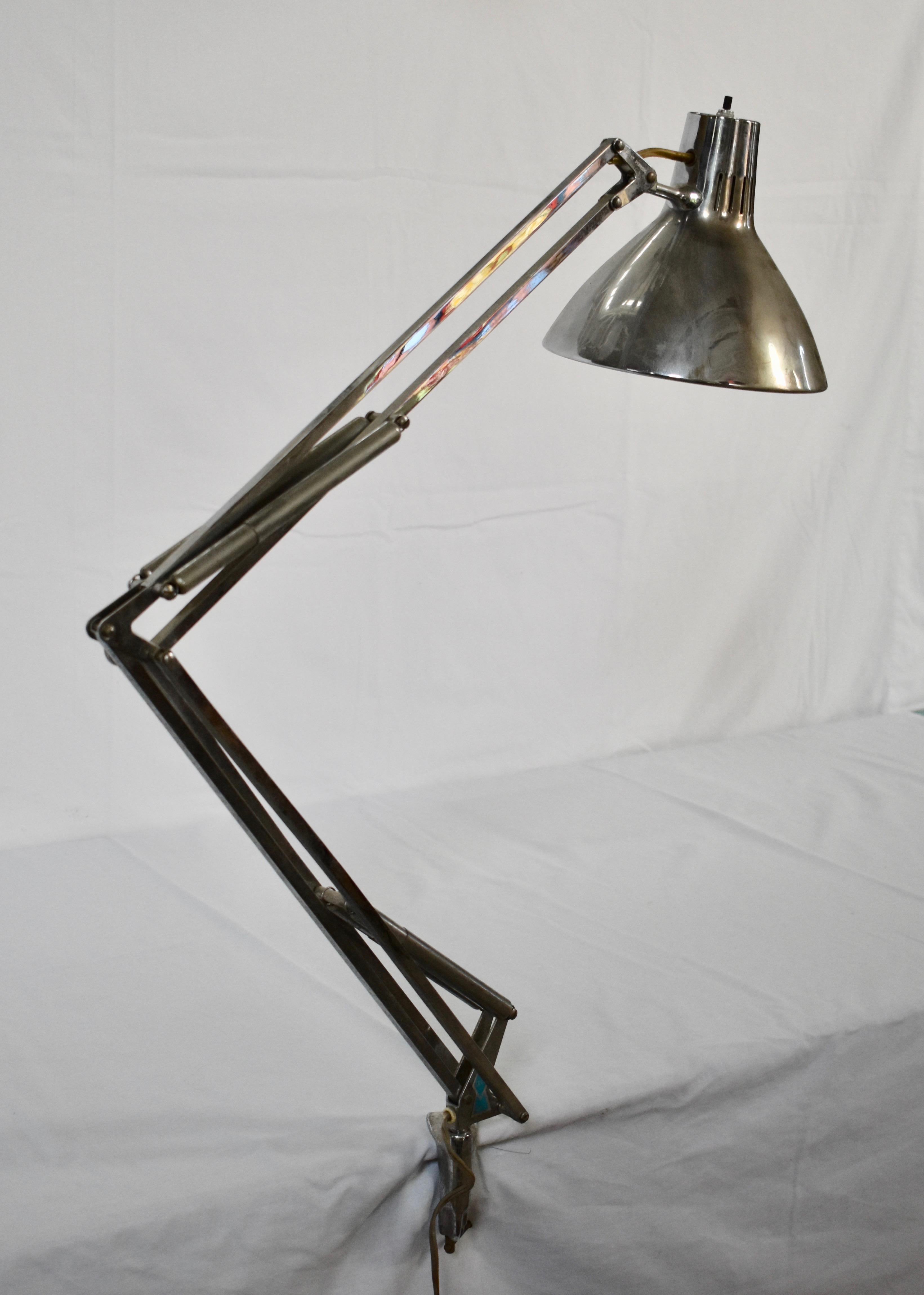 This is a beautiful chrome architect's desk lamp with original clamping hardware, designed by Jacob Jacobsen circa 1960. The fixture retains excellent bright surfaces and perfect adjustment function.