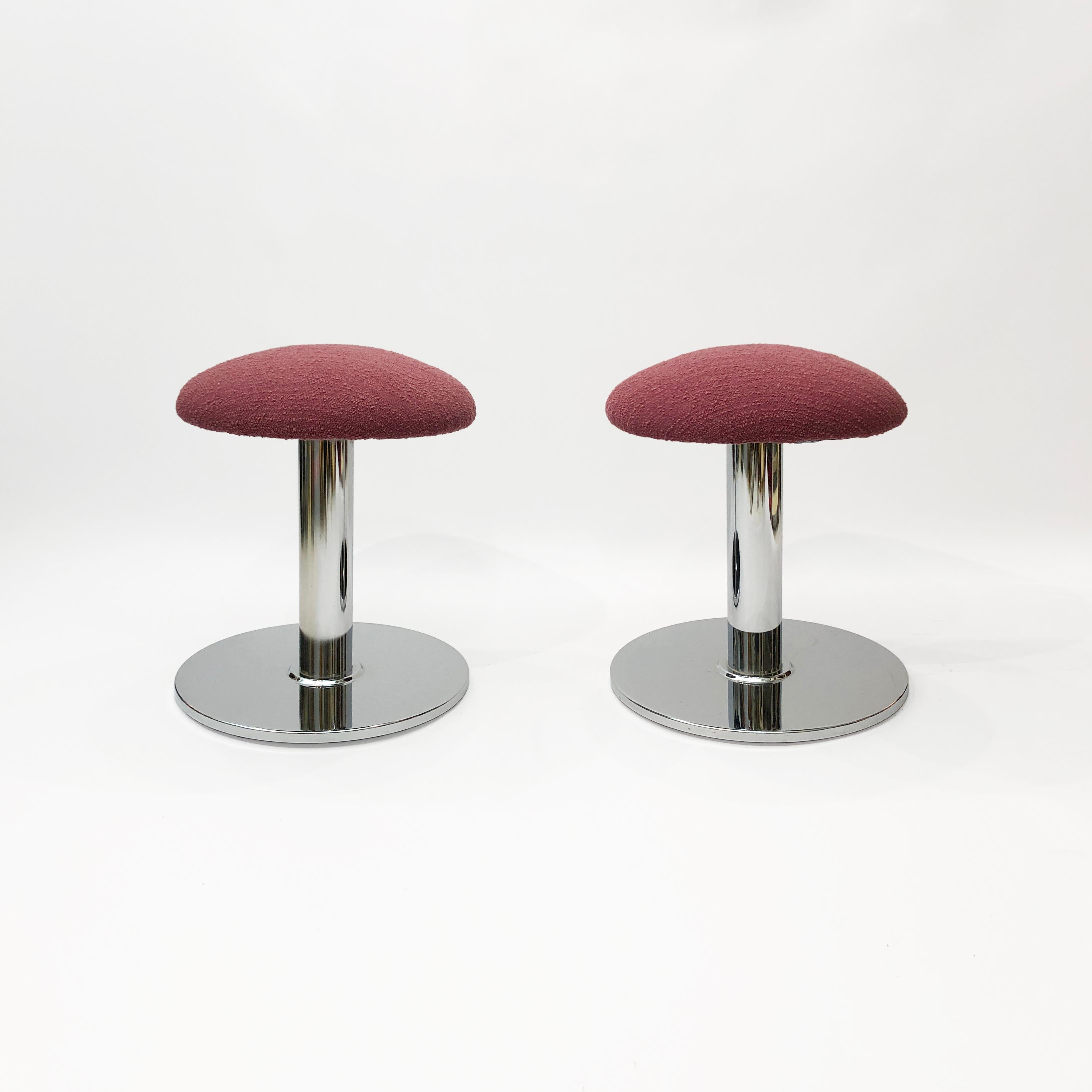 A pair of amazing low-slung stools, in a bold chrome mushroom shape and topped with a bouclé seat. The bouclé is from the prestigious Isle Mill, and is made from organic wool, coloured with a natural dye a fetching aubergine / maroon colour. The