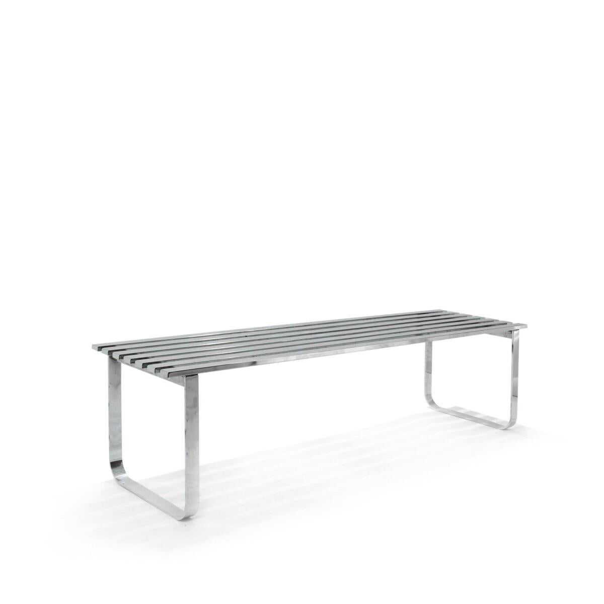 A polished chrome bench with slatted top and curved legs by DIA (Design Institute of America. USA, circa 1970. Unsigned but widely documented.

Dimensions: 60 inches L x 16.5 inches D x 16.5 inches H.