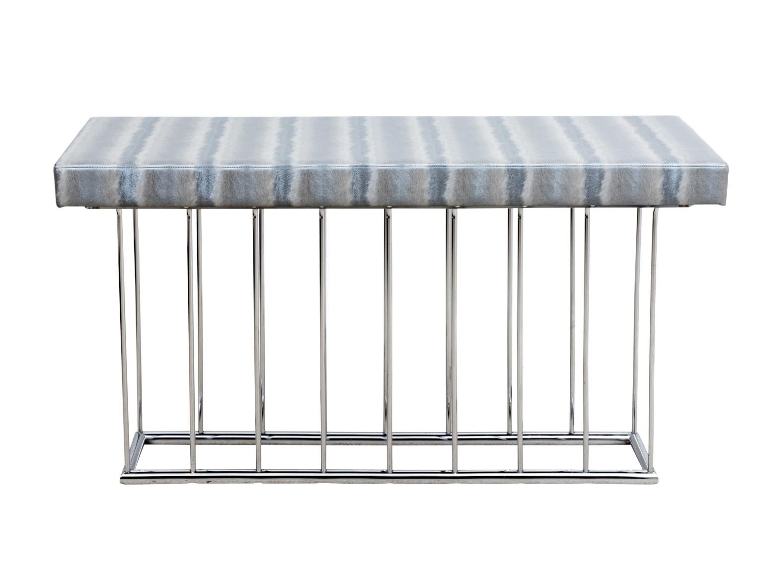 Chrome mid century console table with vinyl upholstered top. In good overall condition with a few marks to the top. 