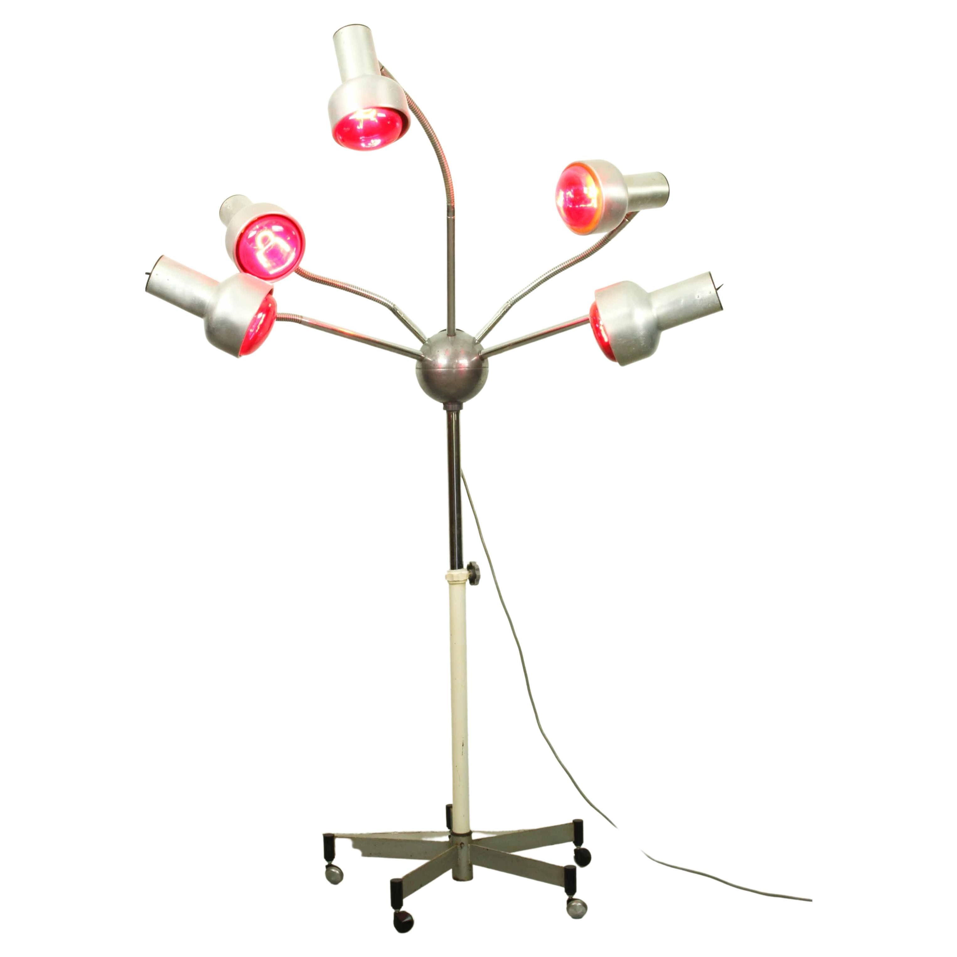 For the real space age fan. Very unusual Mid-Century Chrome lamp with five flexible arms. Adjustable in height. Currently showed with five red heat bulbs(250-300w each). 

Dimensions as displayed (appr): 180cm h, 125cm w, 100cm d.
