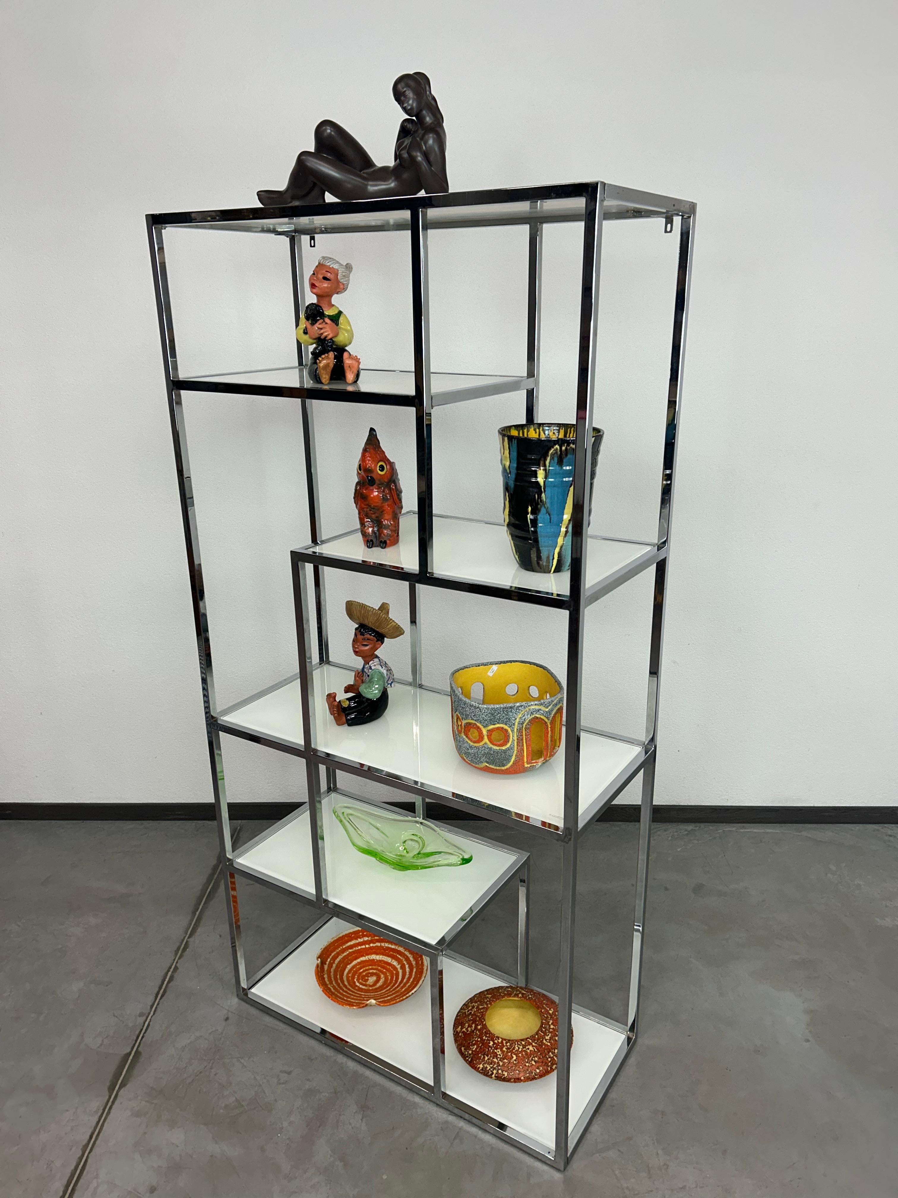 Chrome mid-century modern etagere by Milo Baughman in very nice original condition with white glass shelves.