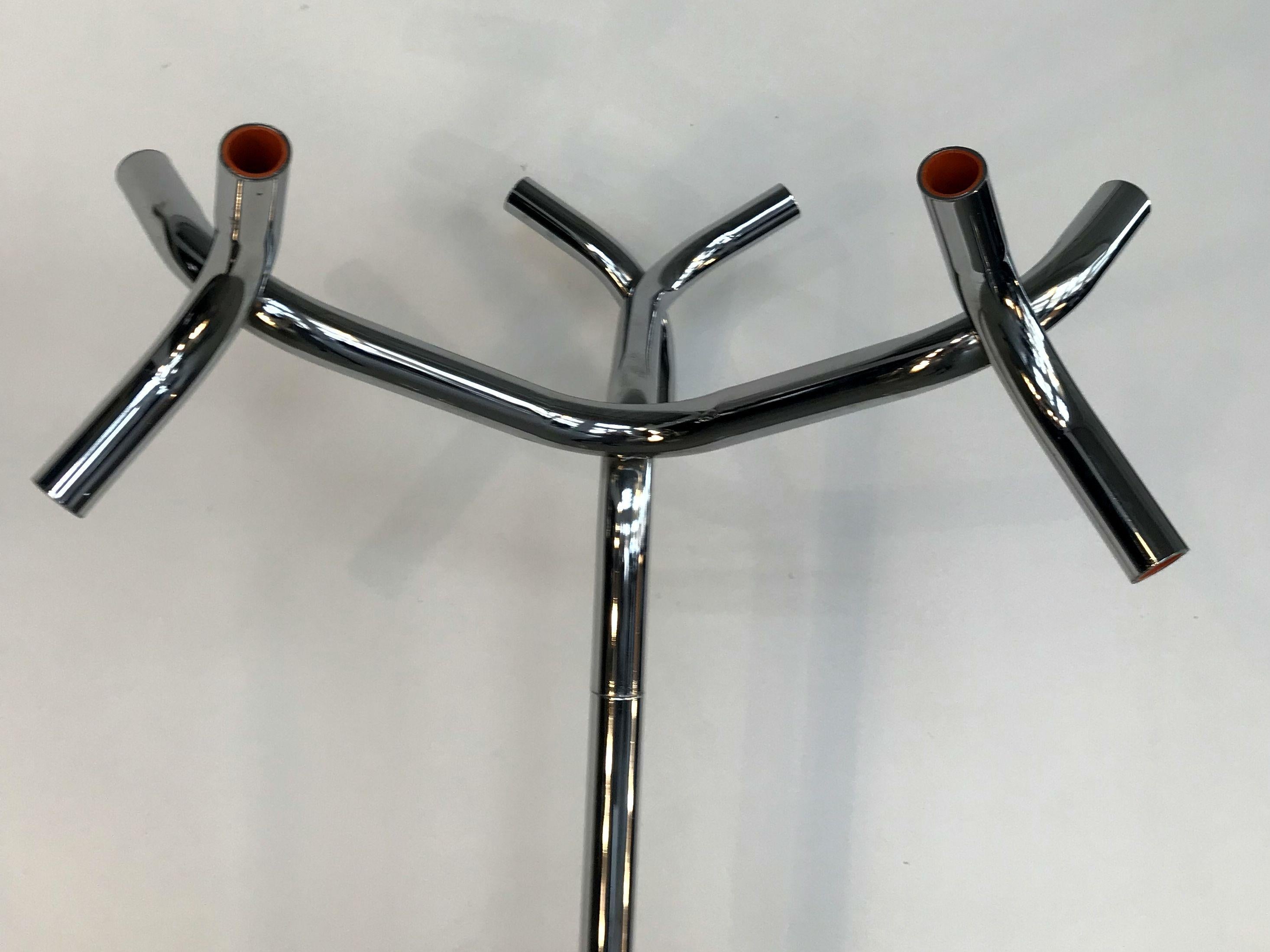 Unique shape chrome coat rack with unusual metal tubes. There is orange acryl inside tubes, 1970s.