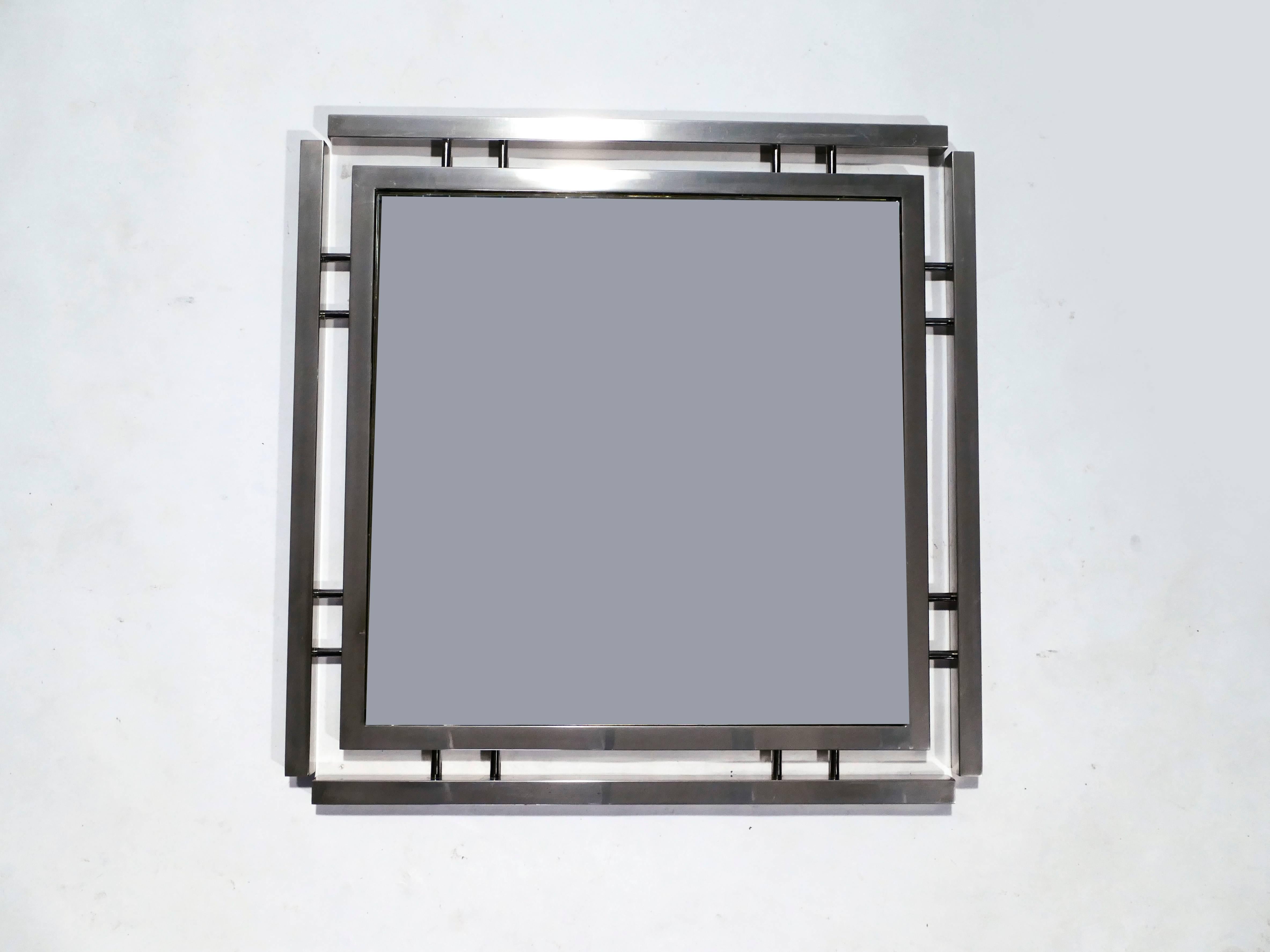With its strong geometric design, this statement mirror is typical of French designer Guy Lefevre’s work for Maison Jansen. Its imposing chrome metal border surrounds the mirror, creating a chic, timeless piece. Found in very good vintage condition