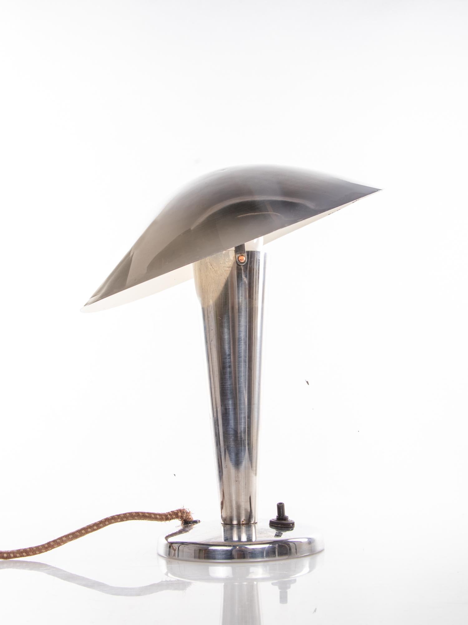 The chrome mushroom shaped adjustable table lamp is a great example of Czech lighting from the 1950s.
Quality, craftsmanship and functionalism in its finest form!
Takes one large Edison bulb E27.
Measurements: Diameter 11.8 in. / 30 cm, height