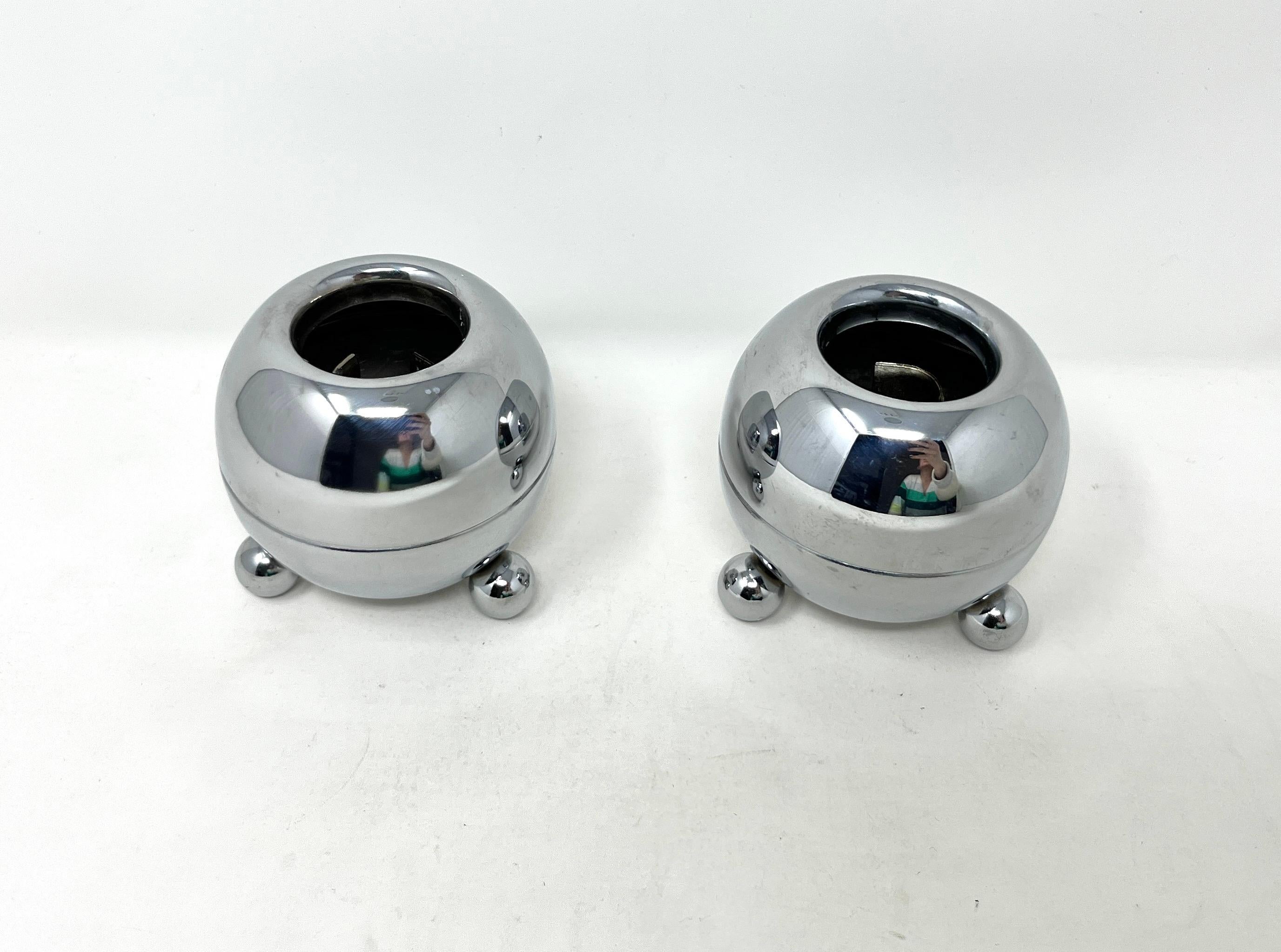 Fun Pair of Chrome Orb-shaped Atomic Age Candle Holders from the Mid-20th Century. Super shiny and bright, the chrome finish adds sparkle and a bit of humor to your table setting. They come apart to facilitate cleaning out the melted wax more