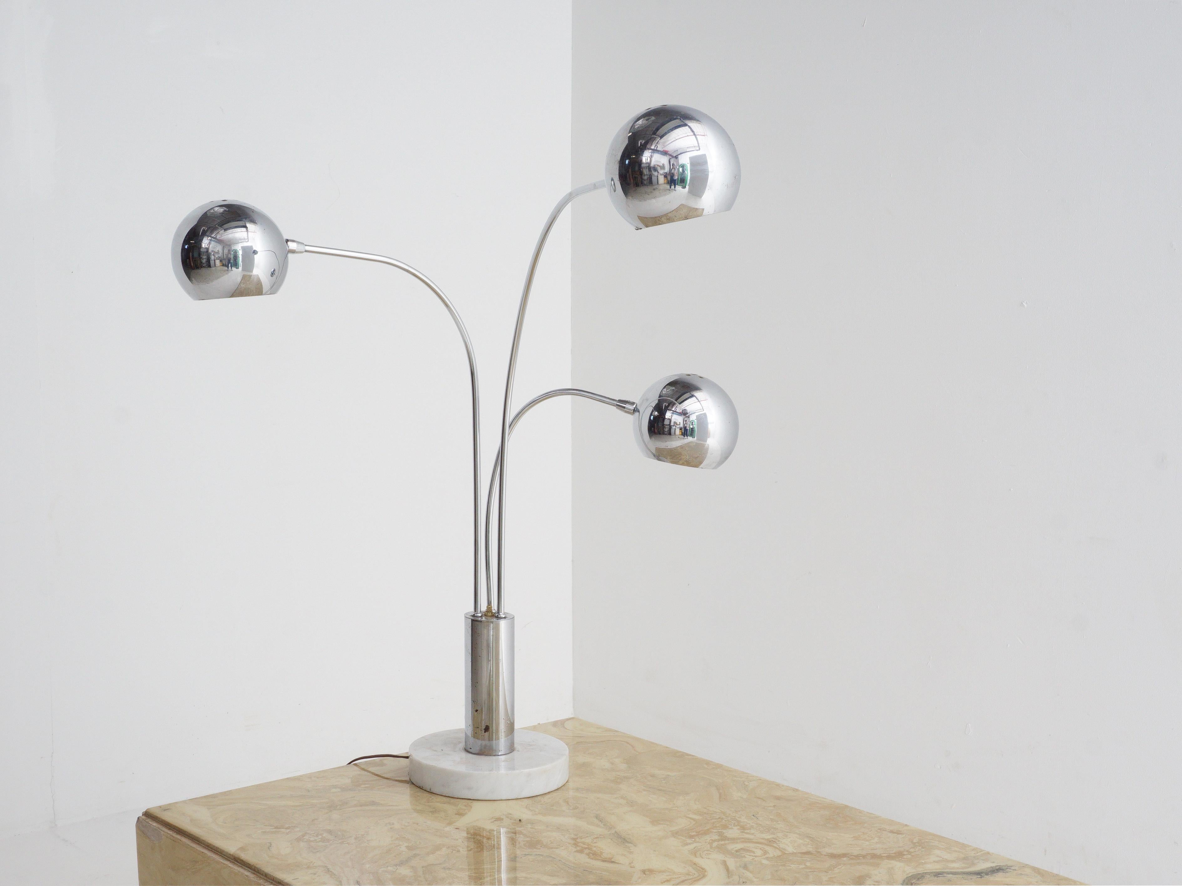 Step into the '70s with this chrome orb and marble table lamp that's here to make a statement. It's like a mini disco ball paired with a sleek marble base, giving your room an instant dose of vintage cool.

- 32