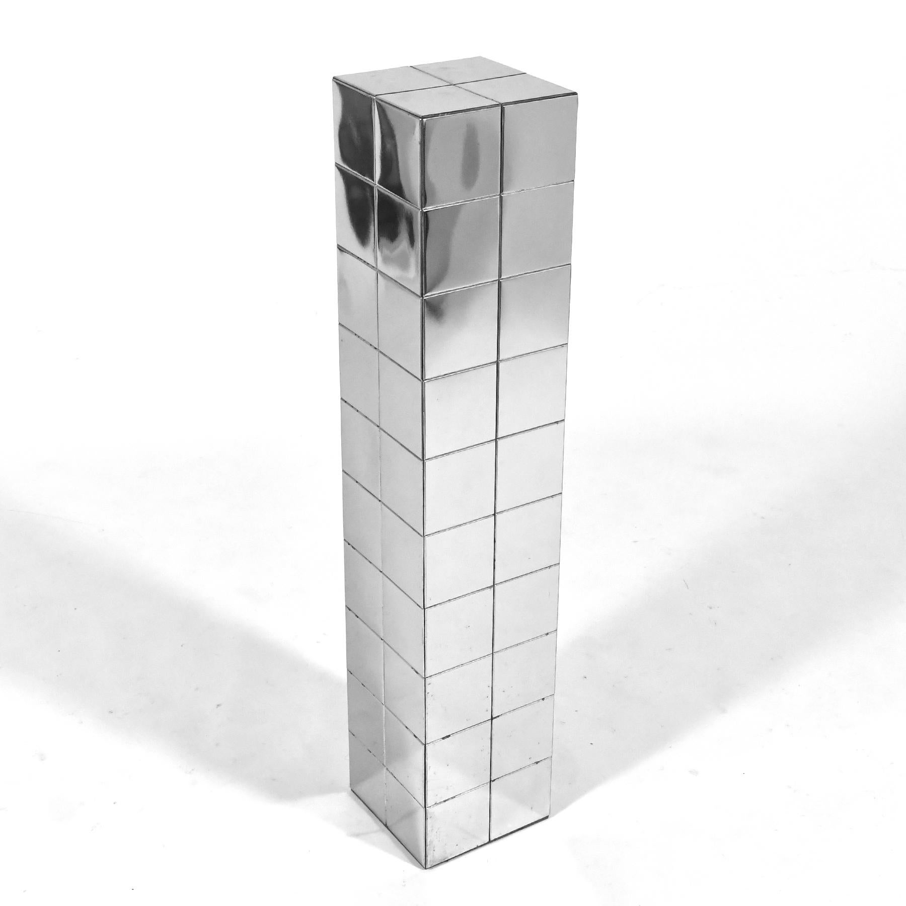 With its patchwork of chrome plates, this pedestal has a similar quality to Paul Evans' 