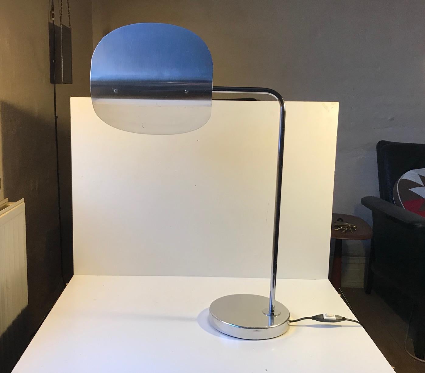 Scanlite is name of this large table lamp from Bergboms. It was designed in-house and manufactured in Sweden during the 1980s. The Minimalist simple lines and the 360 degrees rotating folded circle shade makes it stand out.