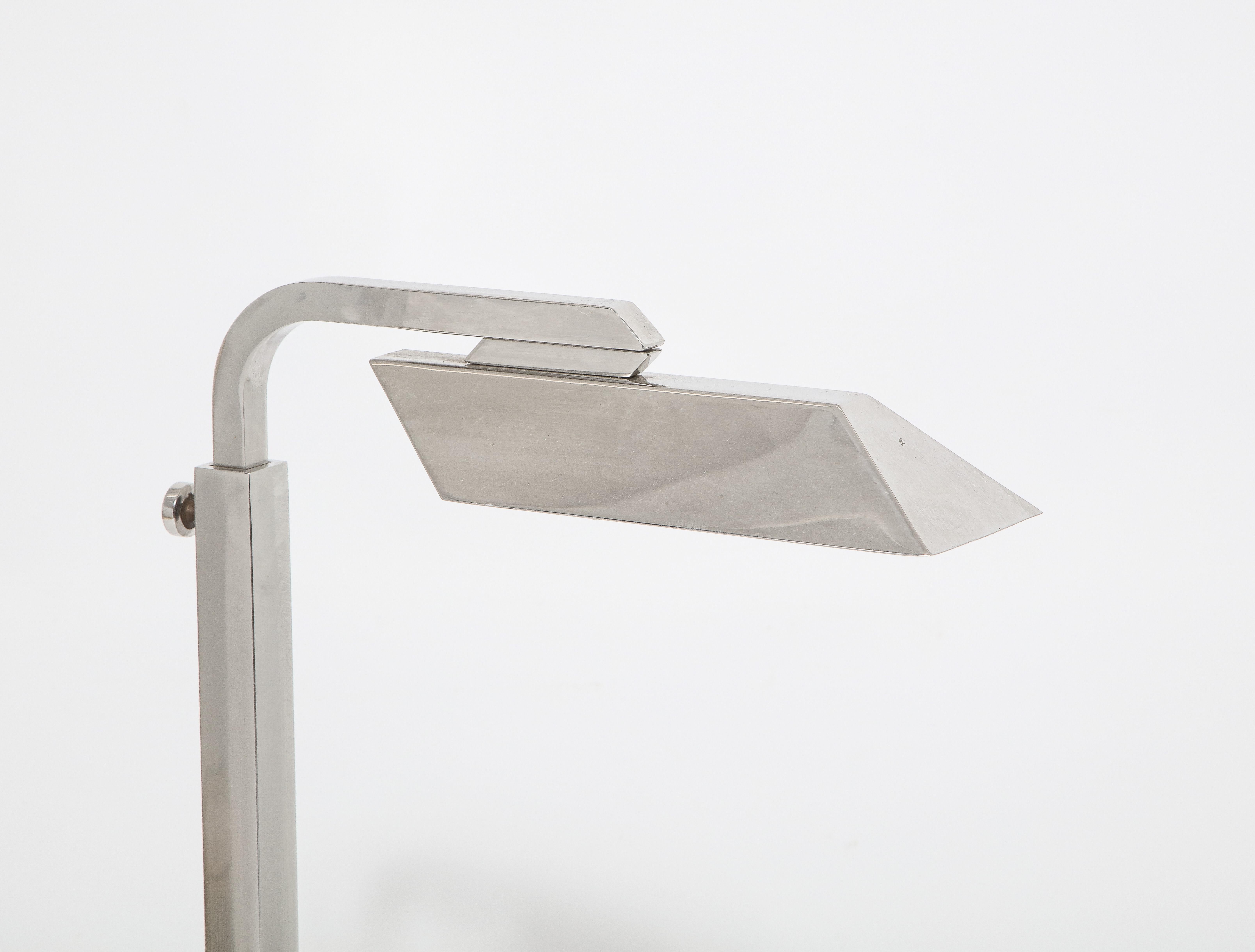 A reading floor lamp with an L-shaped base, adjustable; ideal for corner use.