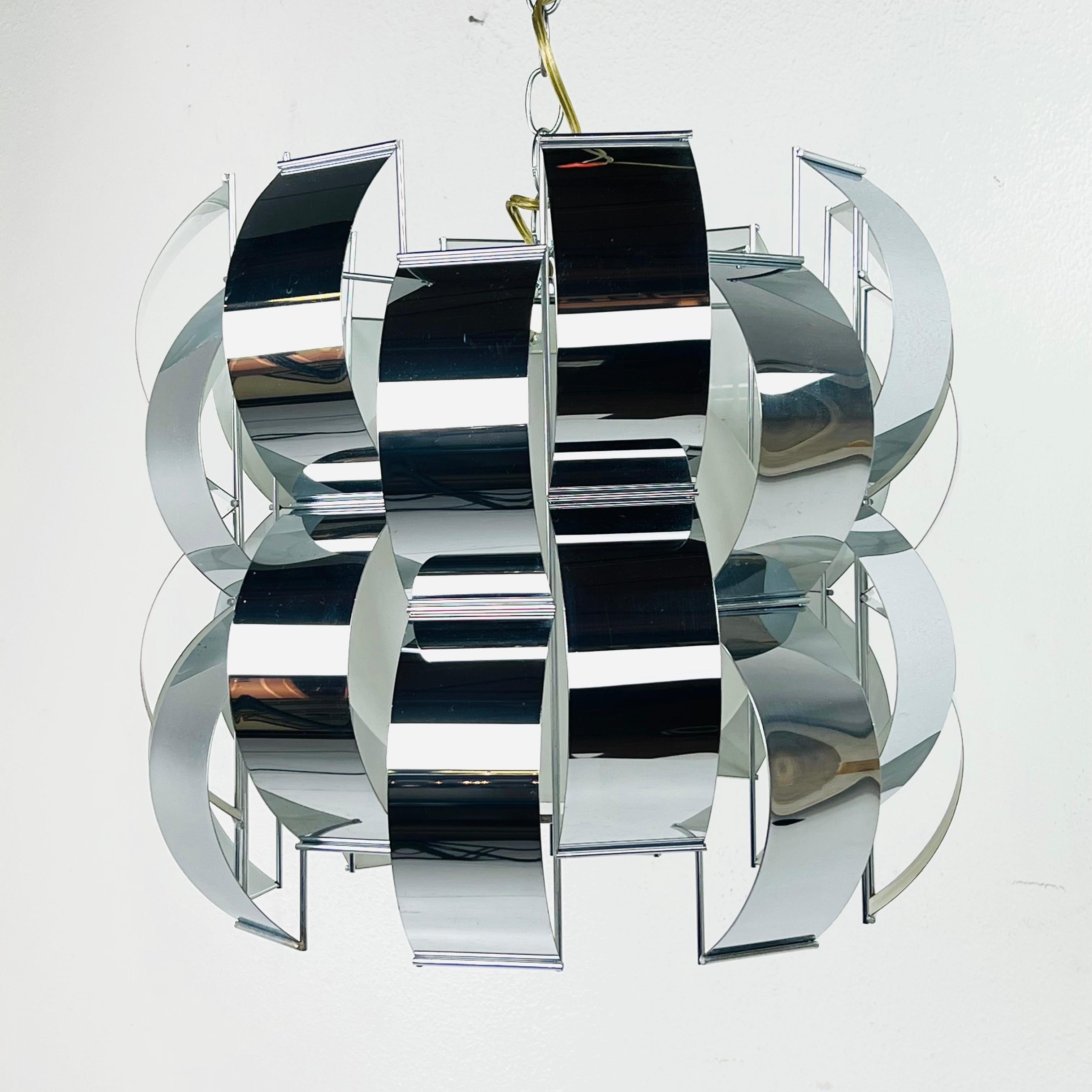 Chic metal ribbon chandelier, designed after Max Sauze for Lightolier, circa 1960s. Bent chrome elements form the 