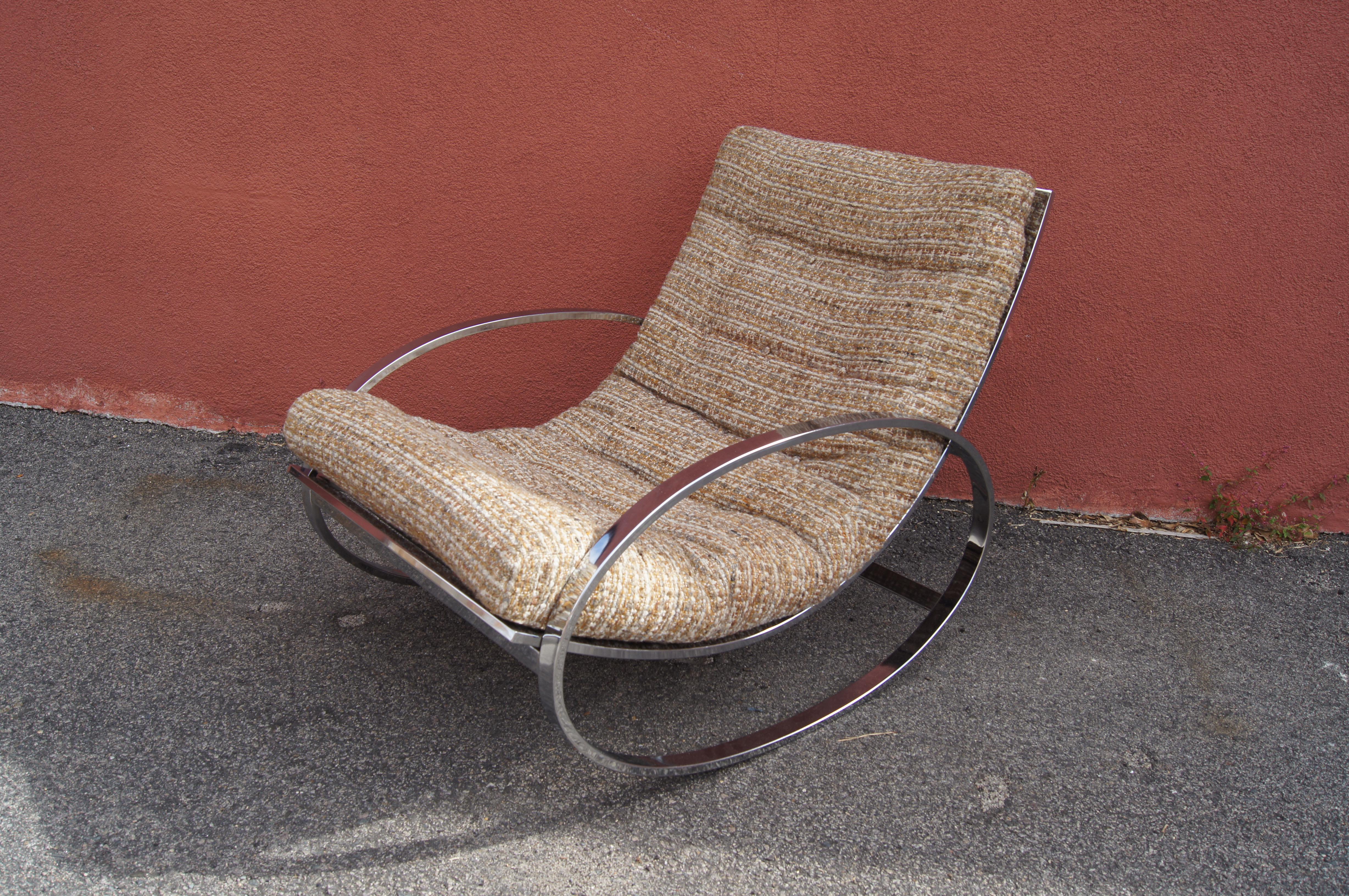 This fabulous rocking chair, made in Italy, imported by Selig, sets a deeply comfortable swoop of cushion on a polished chrome frame between oval rockers.

The seat height ranges from 19 inches at the highest point to 13 inches at the lowest.