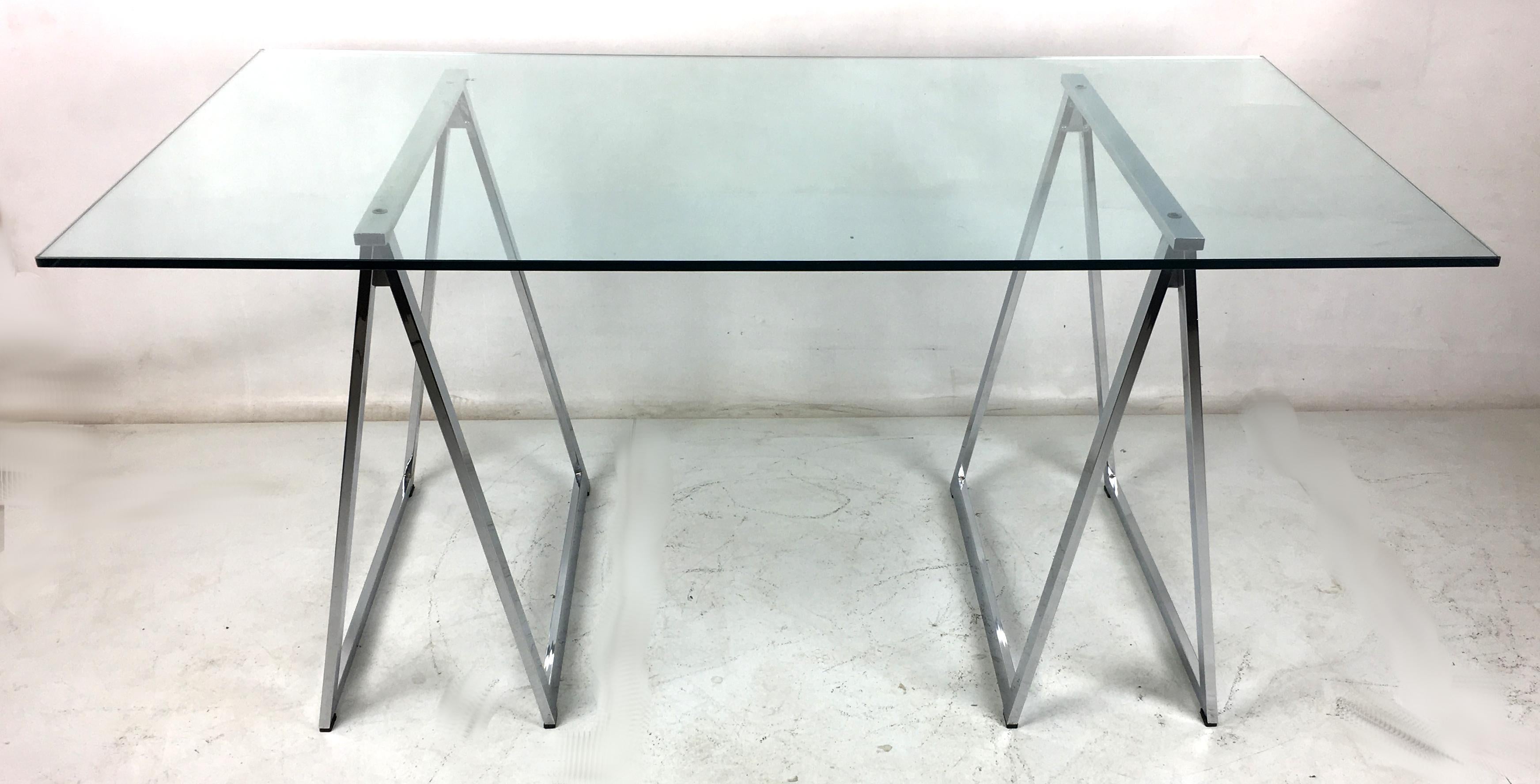 Original Milo Baughman chrome saw horse desk or dining table. The bases are in very good original condition with all its original glides and hardware.