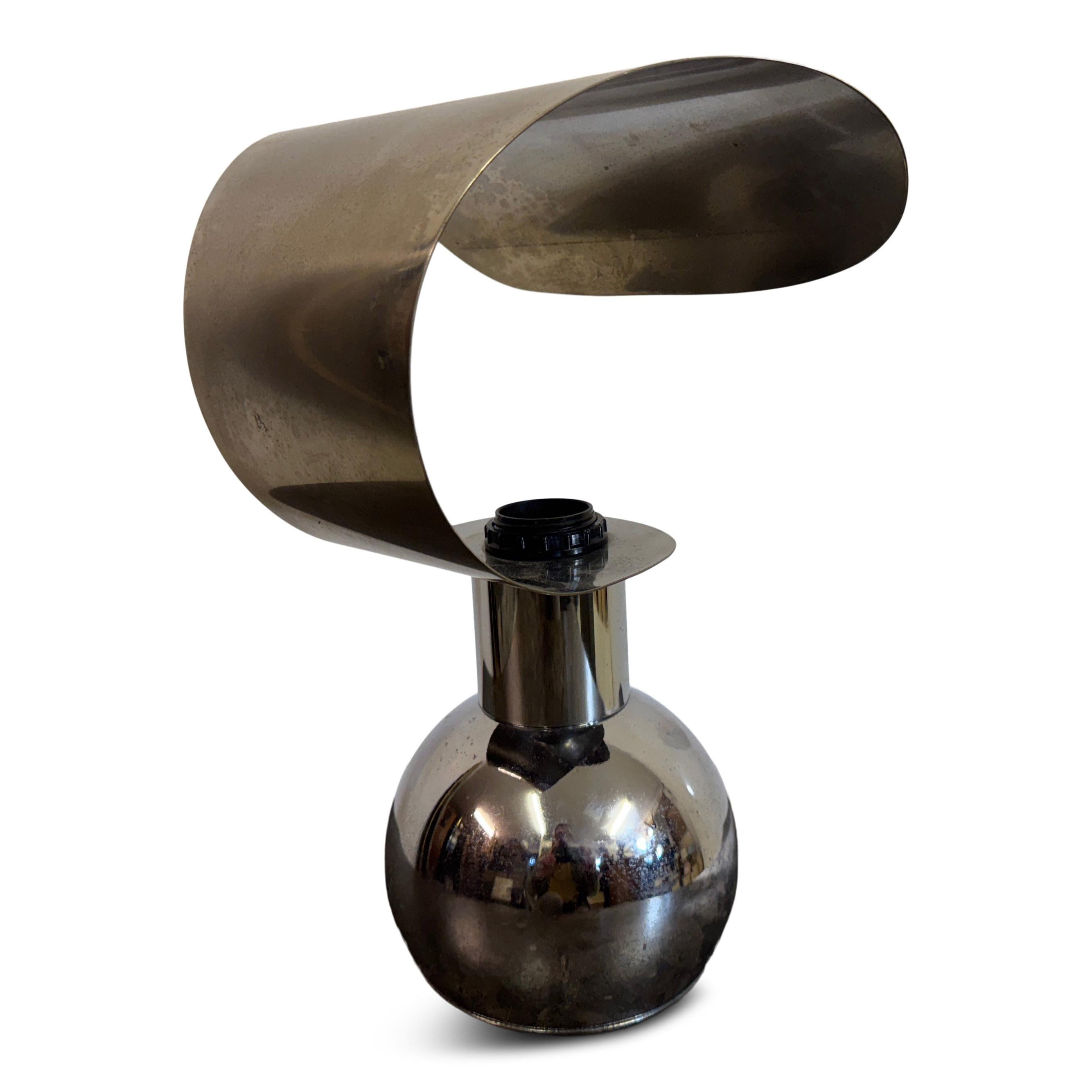 Chrome table lamp

A striking example of mid to late 20th Century design, this sculptural table lamp is crafted from chromed metal, embodying the bold, futuristic aesthetic of the era. The reflective spherical base is complemented by an elegantly